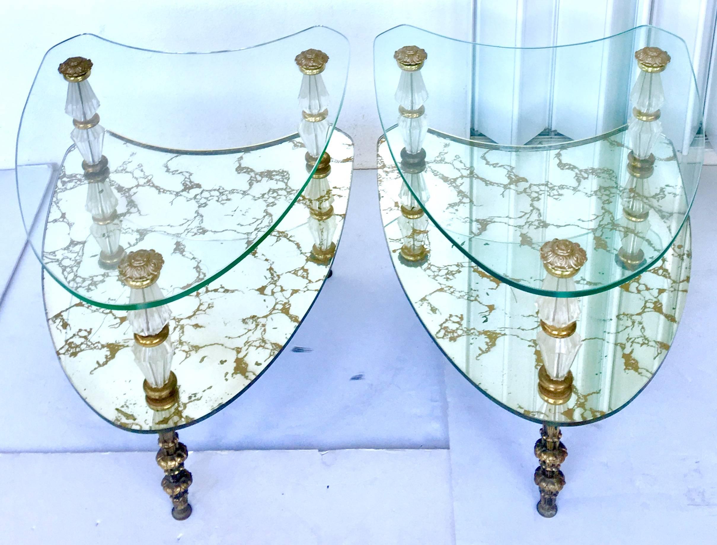 Pair of 1950'S Fantastic Italian Hollywood Regency two-tiered kidney-shaped églomisé mirrored glass side tables. These tables each feature two pieces of stacked  glass, the bottom piece is executed in eglomise technique antiqued mirror finish.m