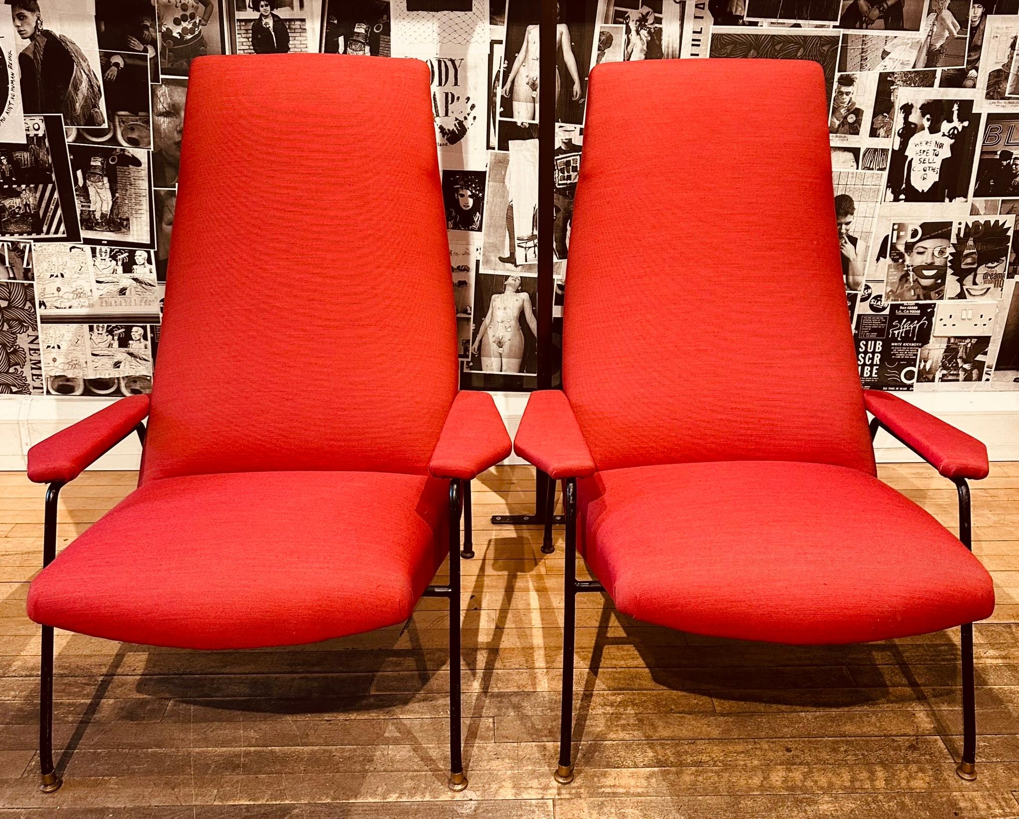 Pair of large and impressive 1950s Italian lounge chairs which are attributed to a design by Augusto Bozzi for Saporiti Italia.  The chairs have been upholstered in a red textured fabric and feature Bozzi's renowned black-painted steel frame with