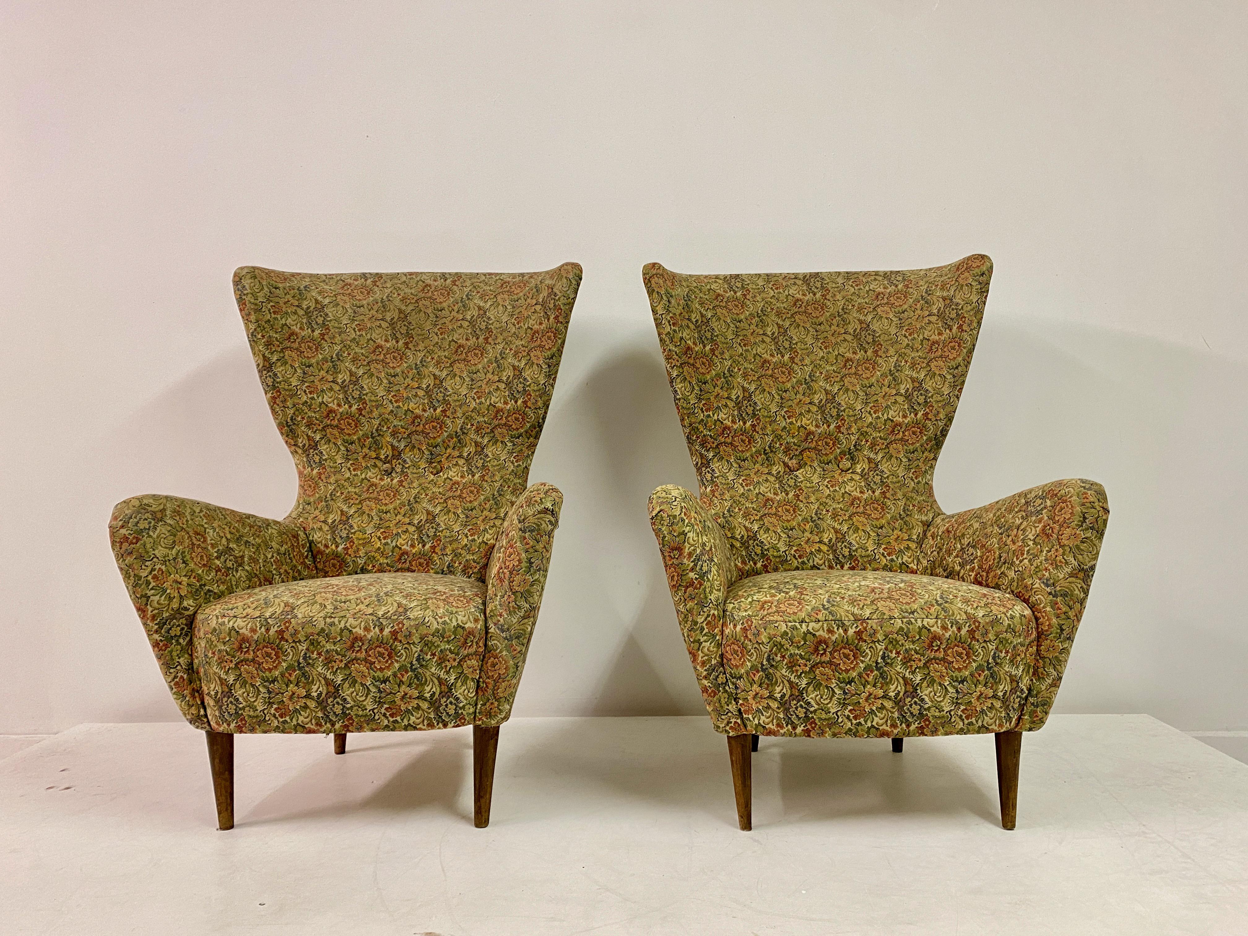 Pair of armchairs

High wing back

Turned wooden legs

Seat height 40cm

Italy 1950s

Will benefit from reupholstery which can be arranged. Please ask for more information.