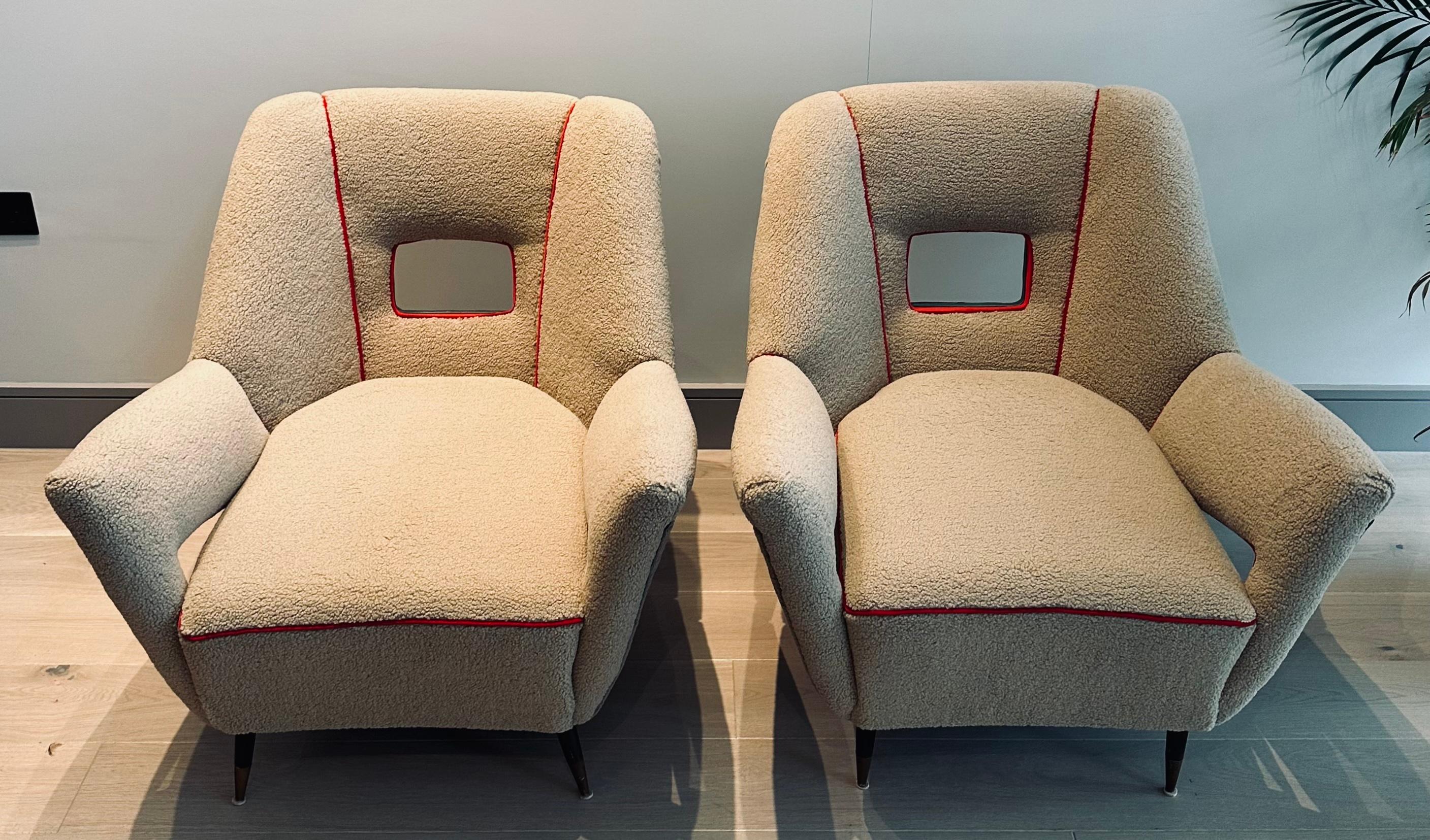 An absolutely stunning futuristic pair of 1950s Italian armchairs attributed to Pierluigi Colli. Newly reupholstered The armchairs are iconic examples of what you would expect from Italian design from the 1950s.  The back rest features a rectangular