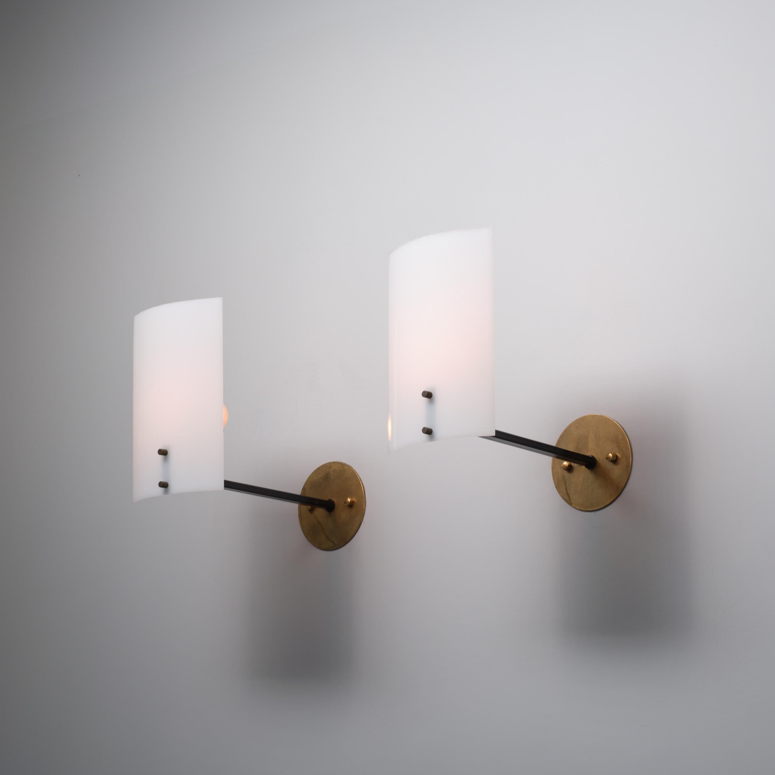 Metal Pair of 1950s Italian Brass  Sconces with Curved White Diffusers For Sale