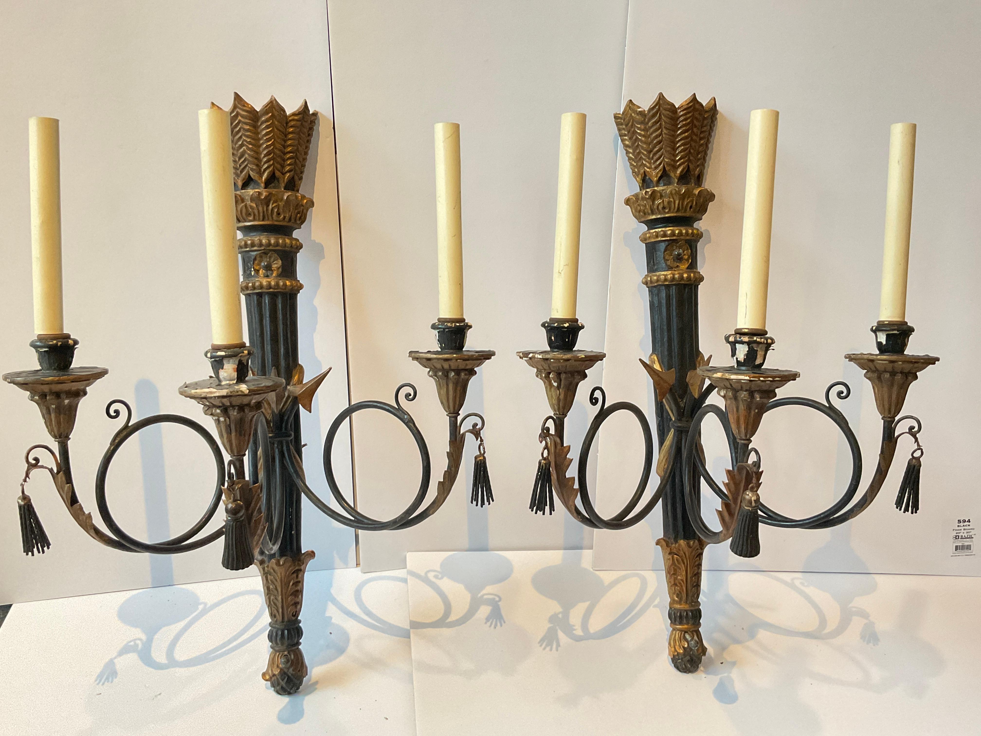 Pair of 1950s hand carved Italian classical arrow sconces from a Southampton, NY estate.