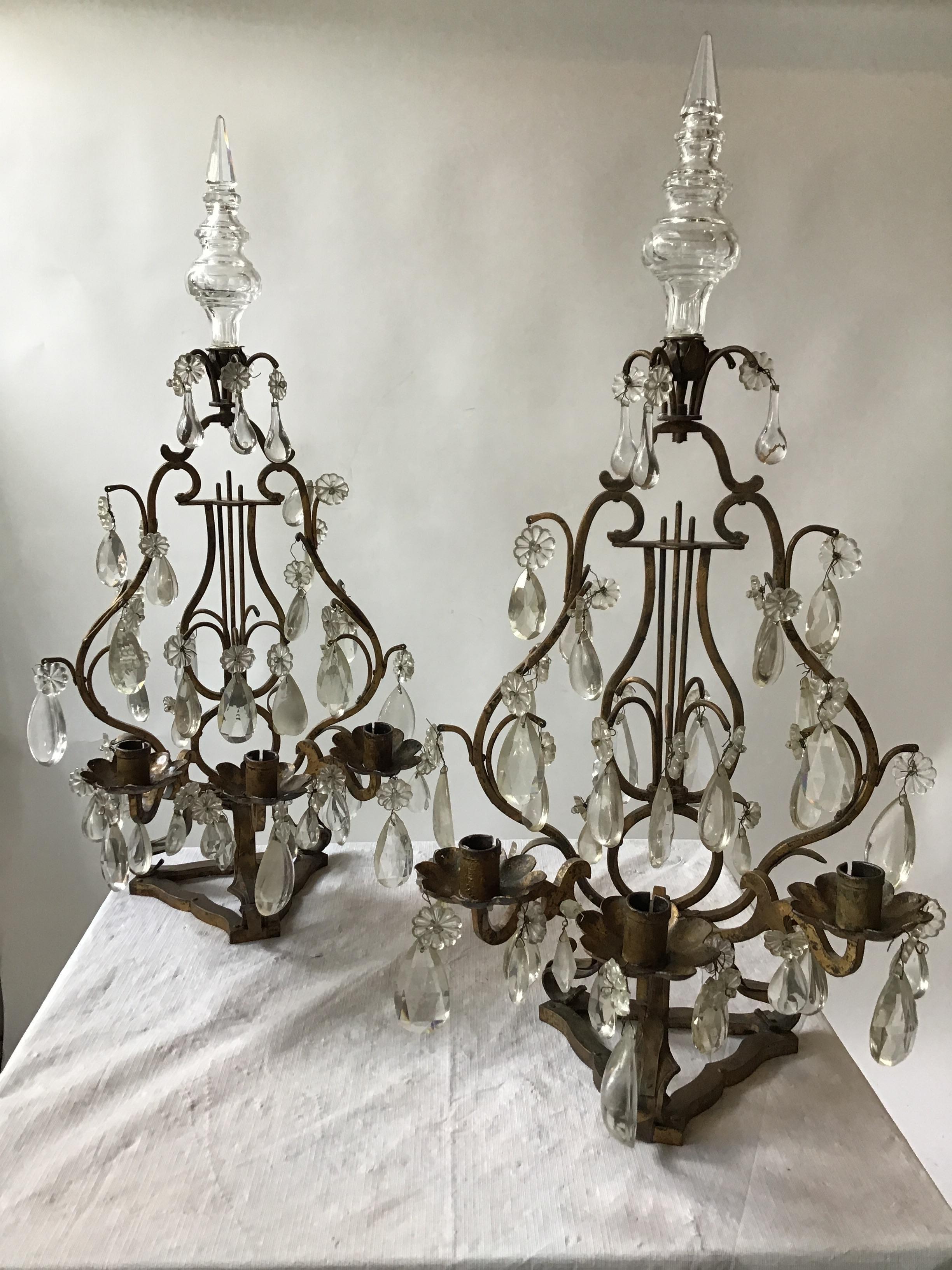 Pair of 1950s Italian gilt-iron and crystal candelabras. Non electrified.
These items can be shipped UPS.