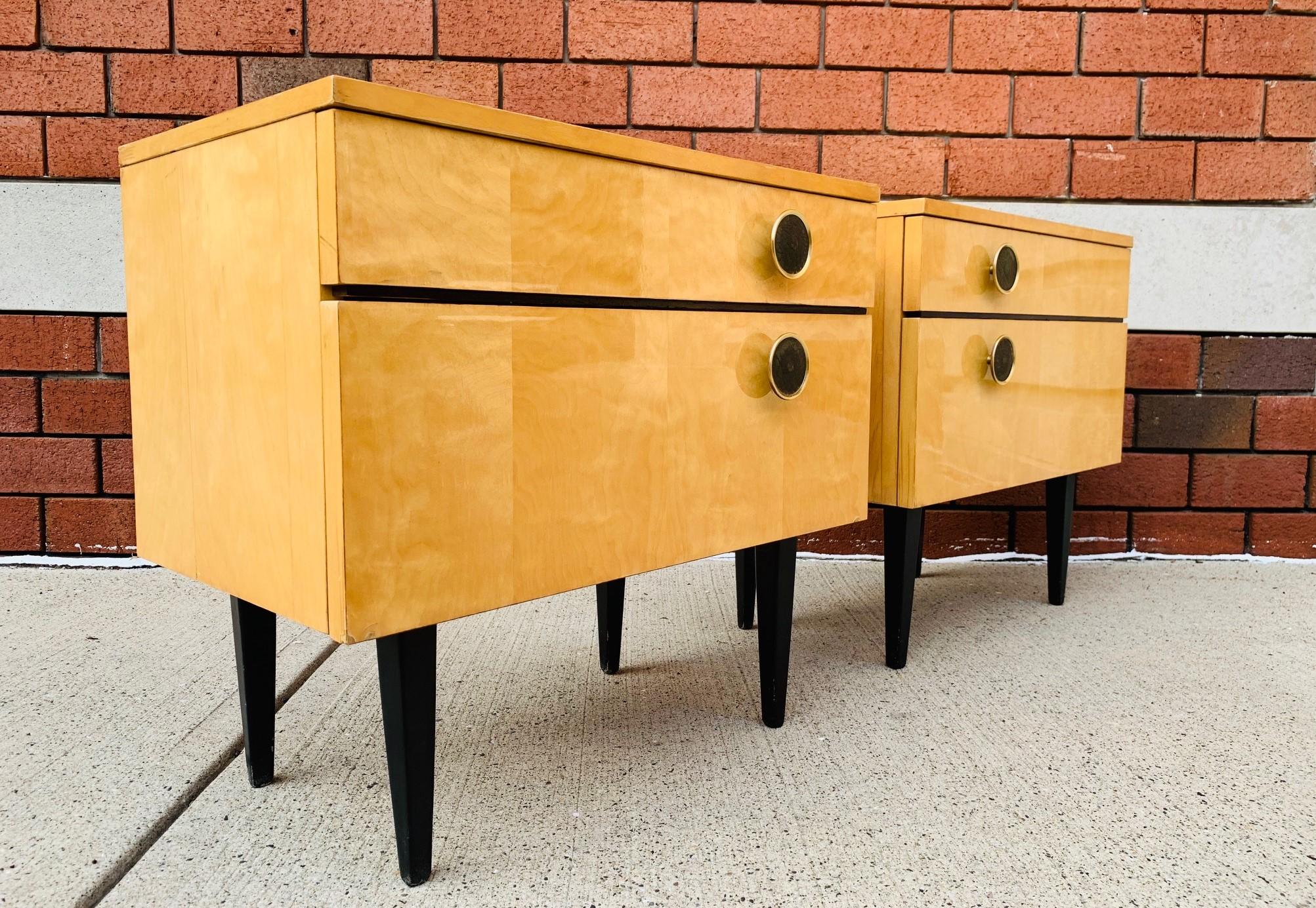 Pair of 1950s Italian nightstands. The nightstands are birch, has a single pull out drawer and a pull down cabinet door with storage. Has embossed leather pull handles and wooden black lacquered legs.
Measures: 12.75 D x 21.5 W x 20.5 H
Inside