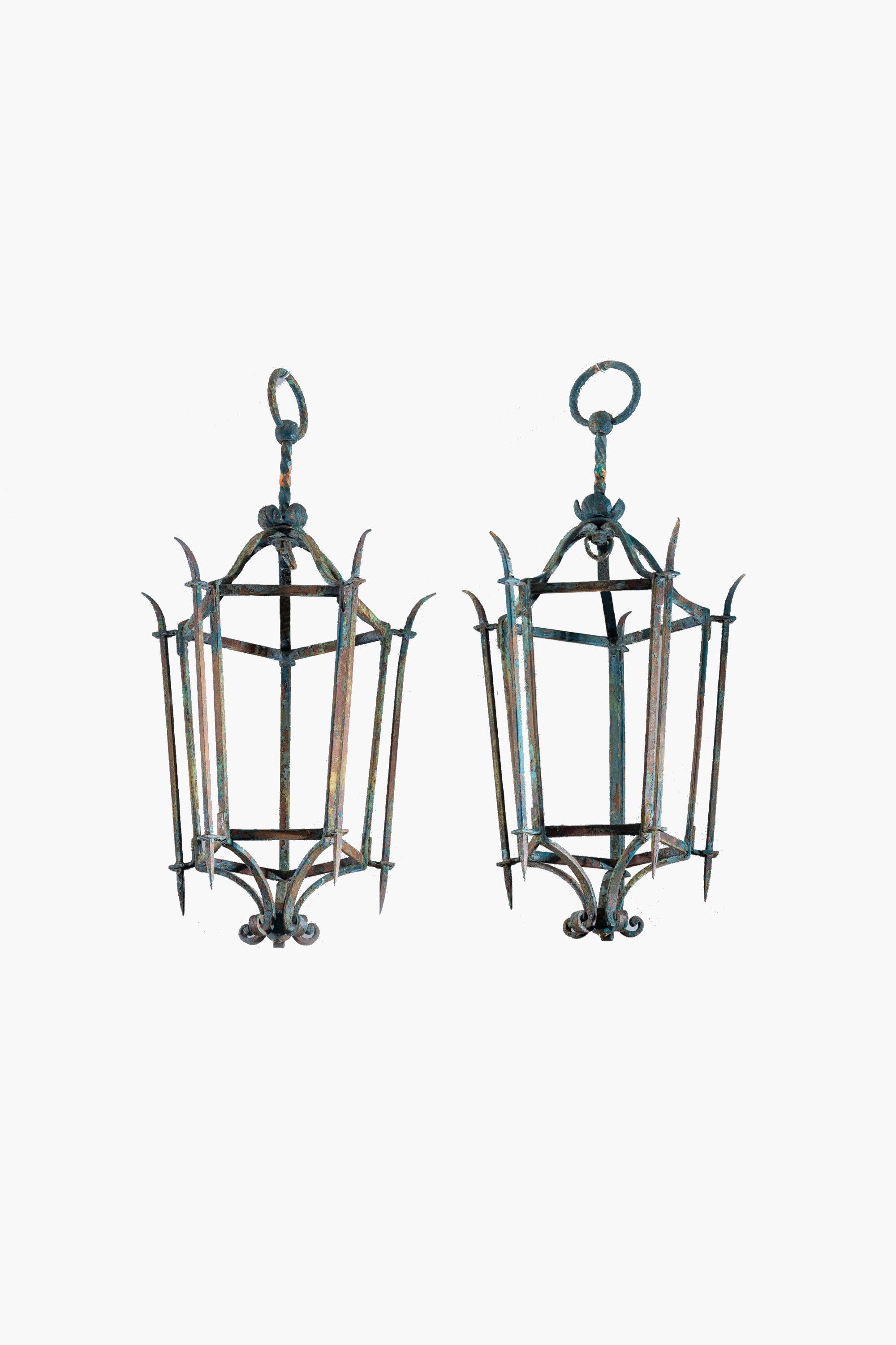 An impressive pair of 1950s Italian wrought iron hall or porch lanterns in the style of Paolo Buffa.

The metalwork has a wonderful overall patina from oxidisation. The present condition could be preserved and lacquered, or stripped and polished
