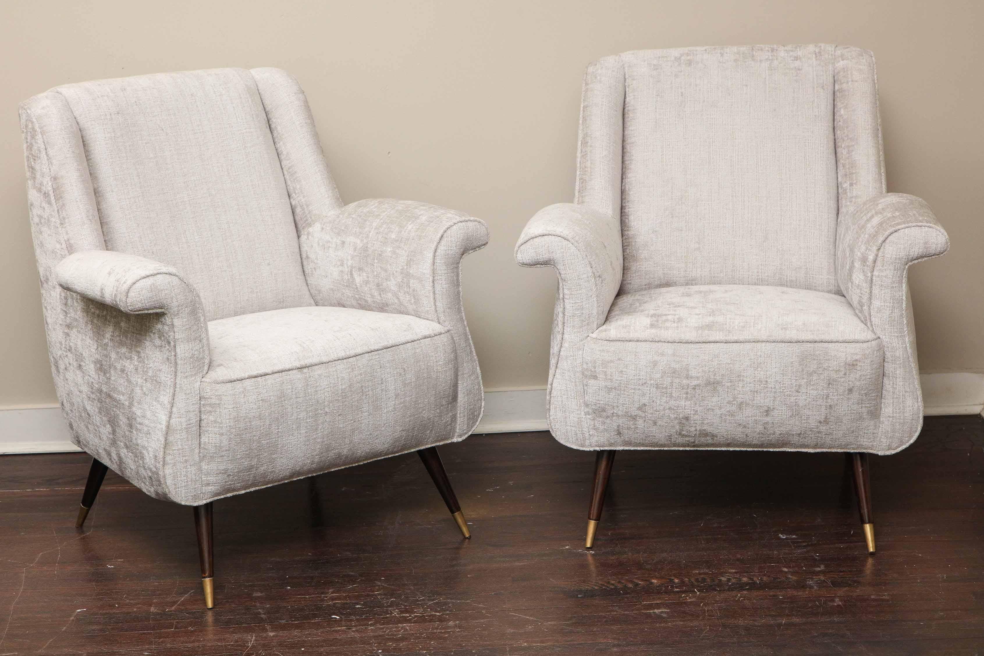 A charming pair of Italian petite rolled armchairs. These chairs are vintage from 1950s and have been reupholstered in platinum velvet.