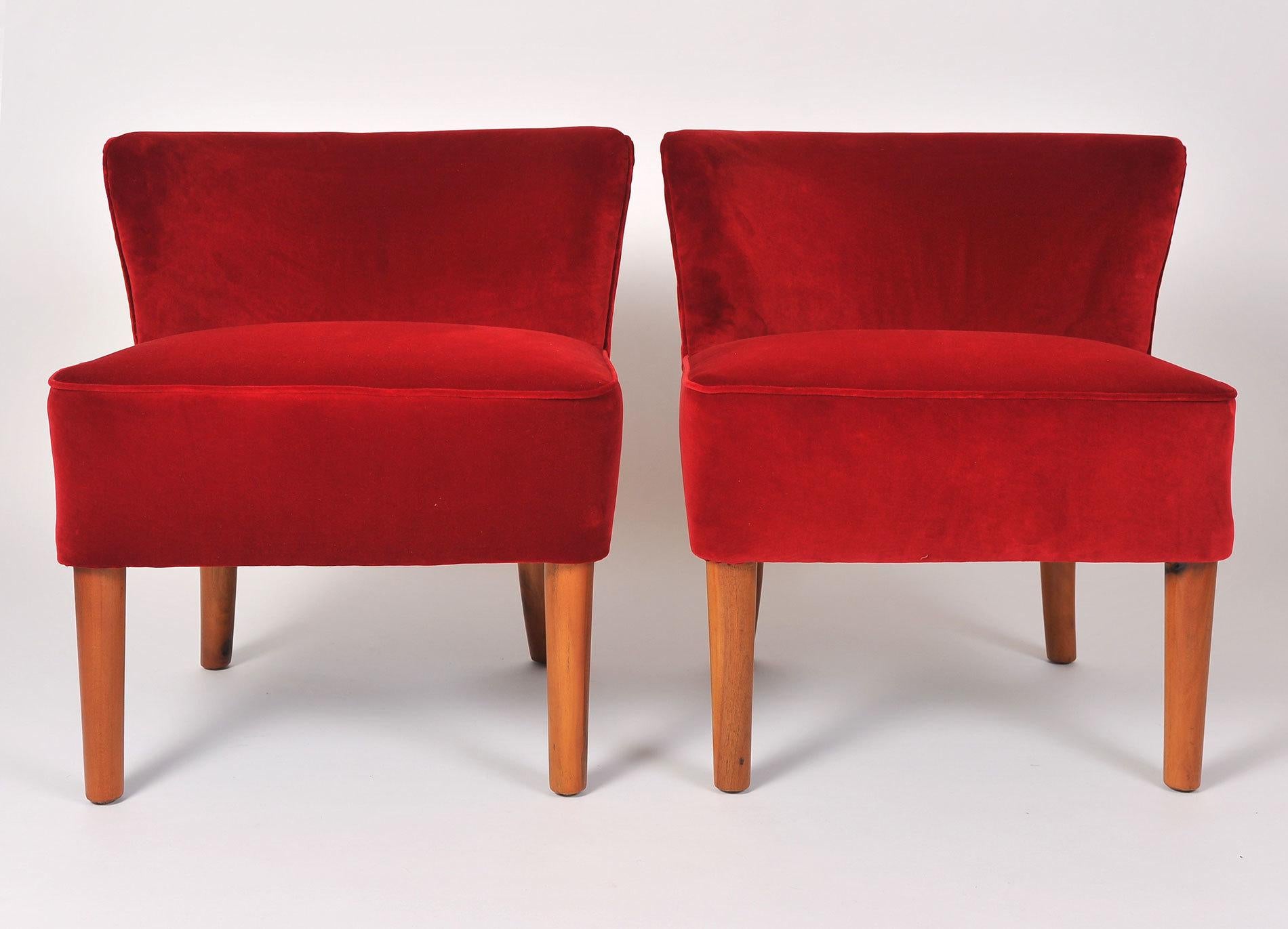 Generous pair of occasional chairs with cherry-wood tapered legs, re-upholstered in red velvet.
