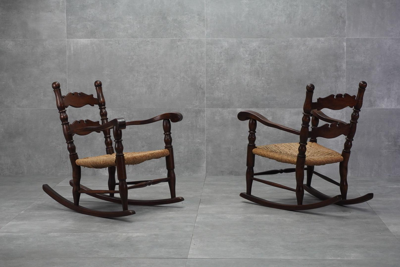 Rustic yet refined, this mathcing pair of italian rocking chairs features handwoven rush seats and a curved wood frame. Dating back to the 1950s, they bring charm and comfort to any room.