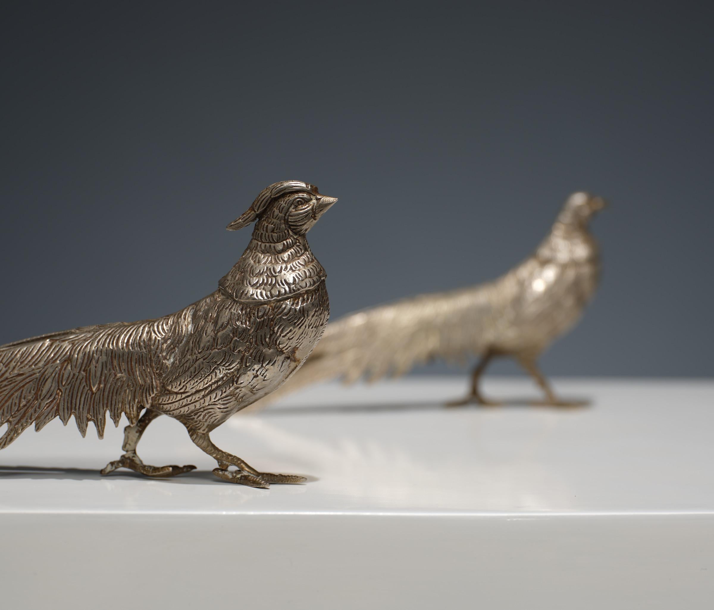 This pair of 1950s Italian silver pheasants is a testament to the elegance and timelessness of Italian design during the mid-century era.

Mid-Century Italian Design: These silver pheasants reflect the sophistication and artistic flair of Italian