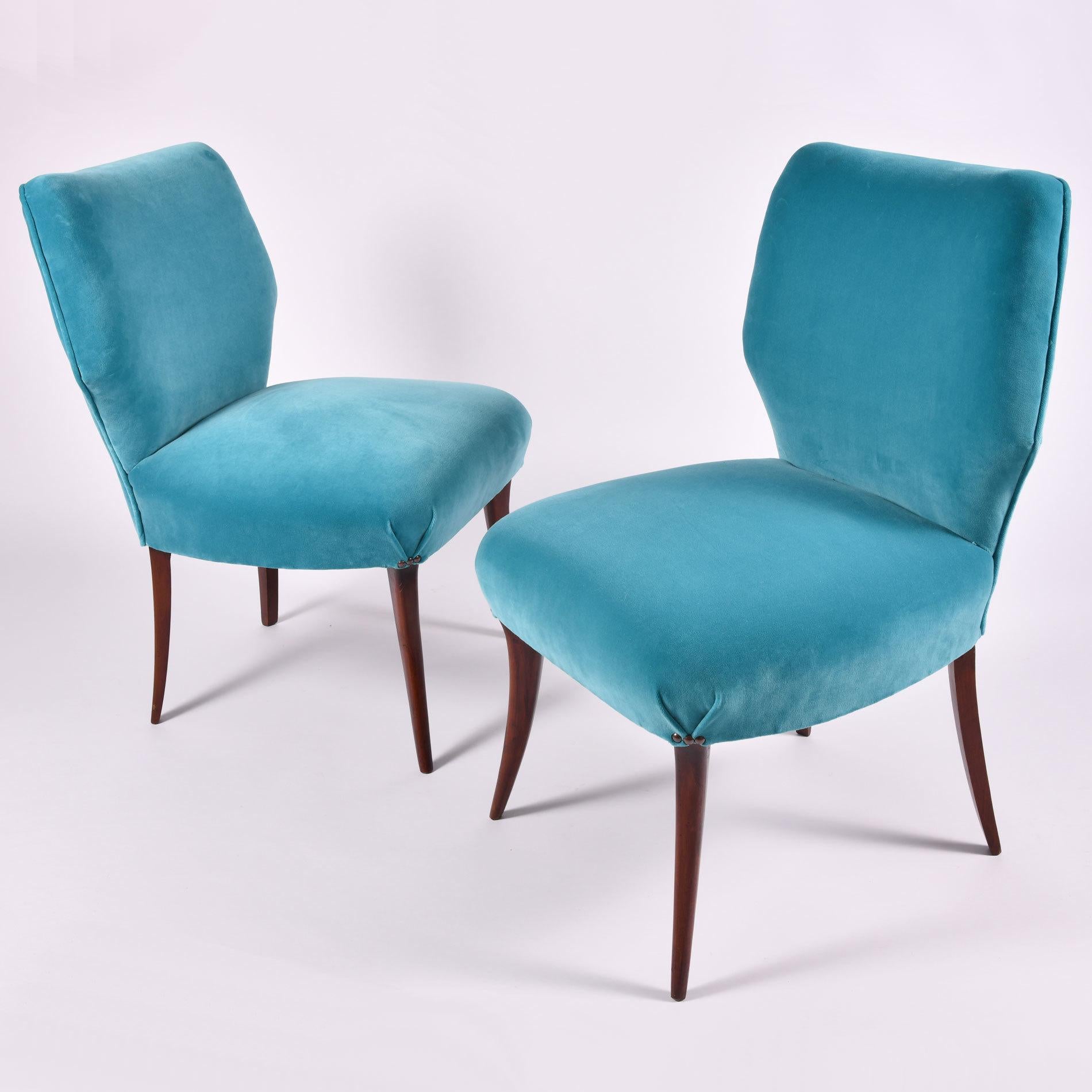 Mid-Century Modern pair of occasional chairs with dark wood tapered legs, re-upholstered in turquoise velvet.