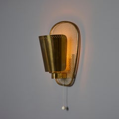 Coppia di lampade in ottone e metallo traforato Jacques Biny degli anni '50 per Luminalite