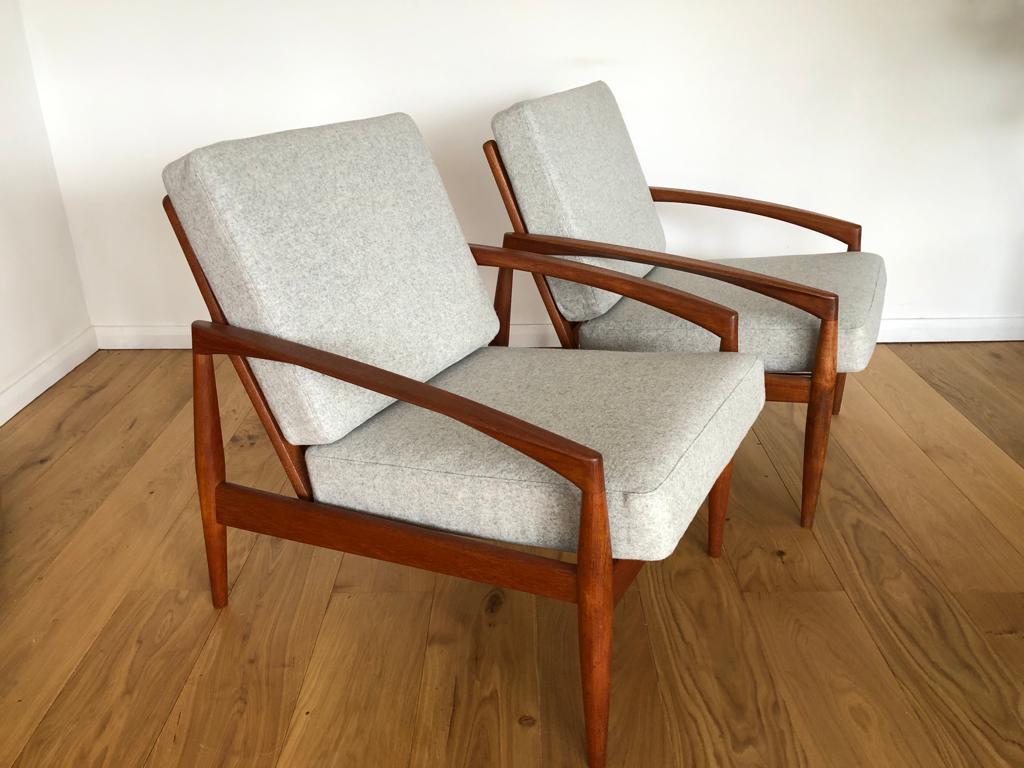 A pair of rare and highly sought after 1950s ‘Paper Knife’ lounge armchairs which are one of the iconic Danish designs of the mid century design period.  Designed in 1955 by Kai Kristiansen and produced in Denmark by Magnus Olesen. The armchairs