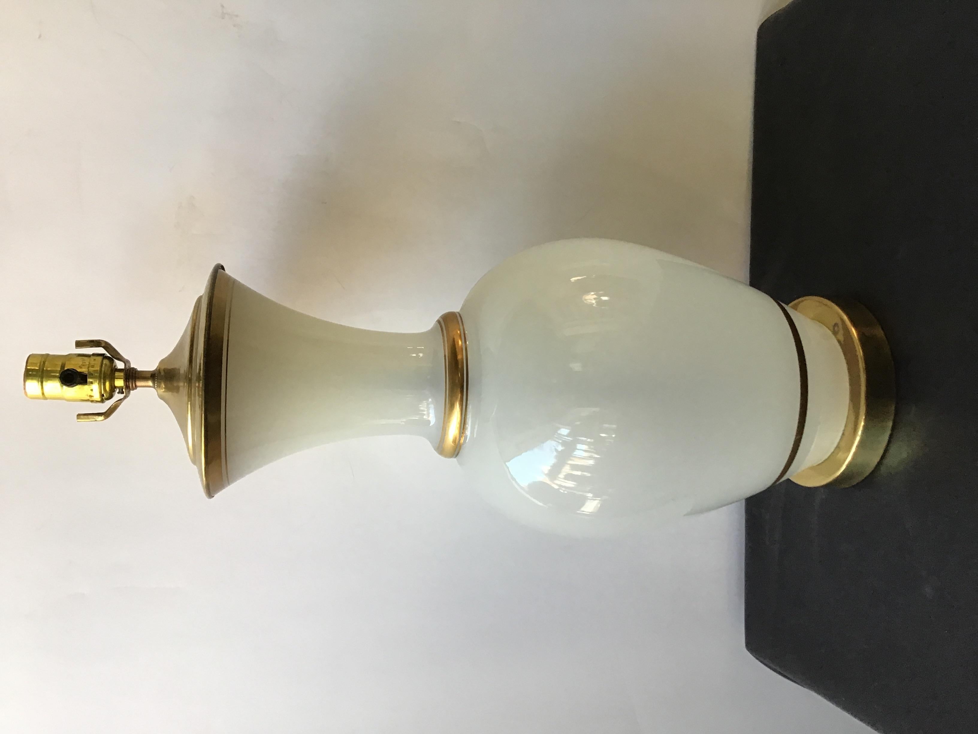 Pair of large 1950s opaline glass lamps with gold trim and solid brass fittings.