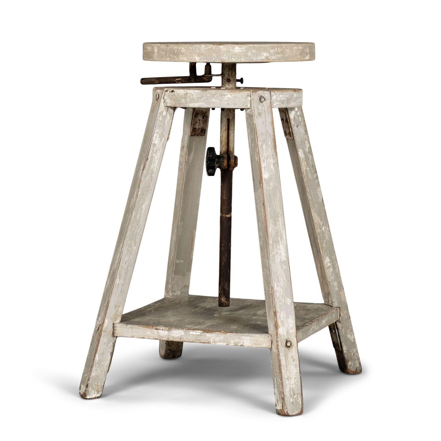 Pair of circa 1950s light-gray painted French sculptor's stands. Adjustable 15.75 inch diameter tops (raise up to 43.5 inches in height as well as swivels). Original or early light gray and white painted finish with fading and losses. Nail and screw