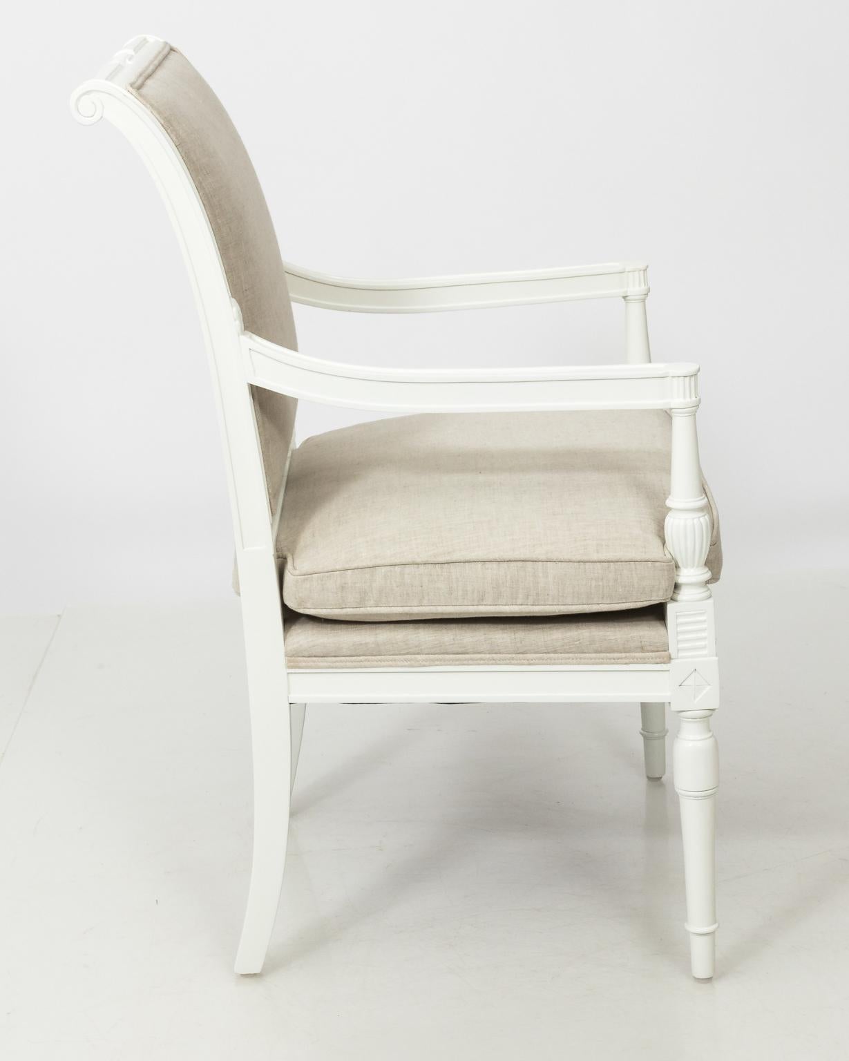 Pair of 1950s Louis XV style white painted armchairs with vase turned arm supports in newly upholstered fabric.
     