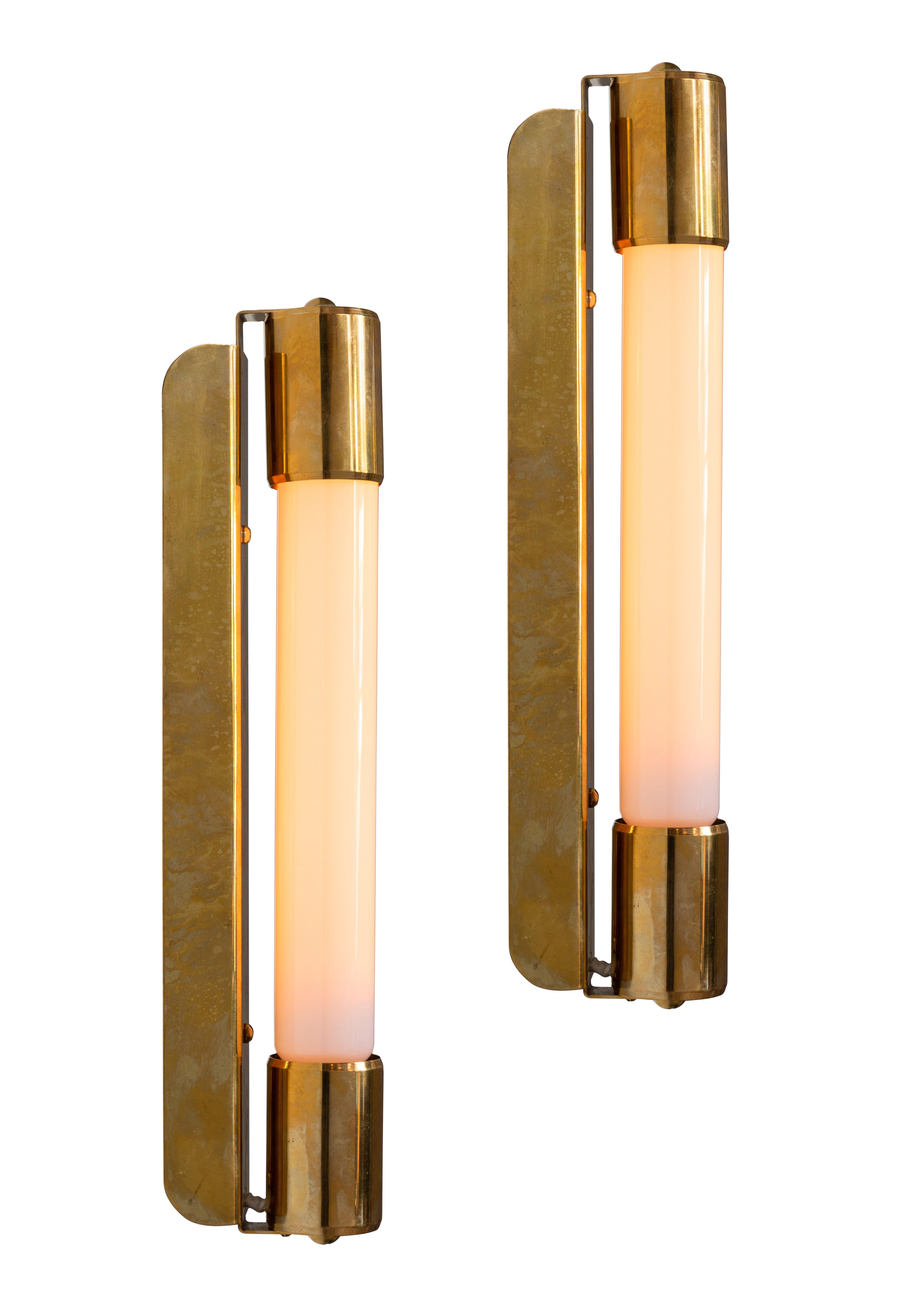 Pair of 1950s Mauri Almari Model No. 71032 Wall Lamps for Idman. A rare example executed in solid brass, with manufacturer's stamp. Highly reminiscent of Paavo Tynell's iconic designs for Taito Oy. An incredibly refined design that is