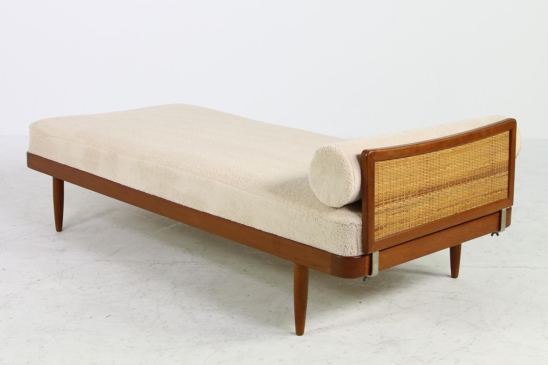 Beautiful and rare, set of two 1950s daybeds, teak frame and teak legs, new upholstery and covered with super soft teddy bear faux fur (like very soft sheepskin) with a matching neck roll, removable teak and cane headboard, very rare pieces, Made by
