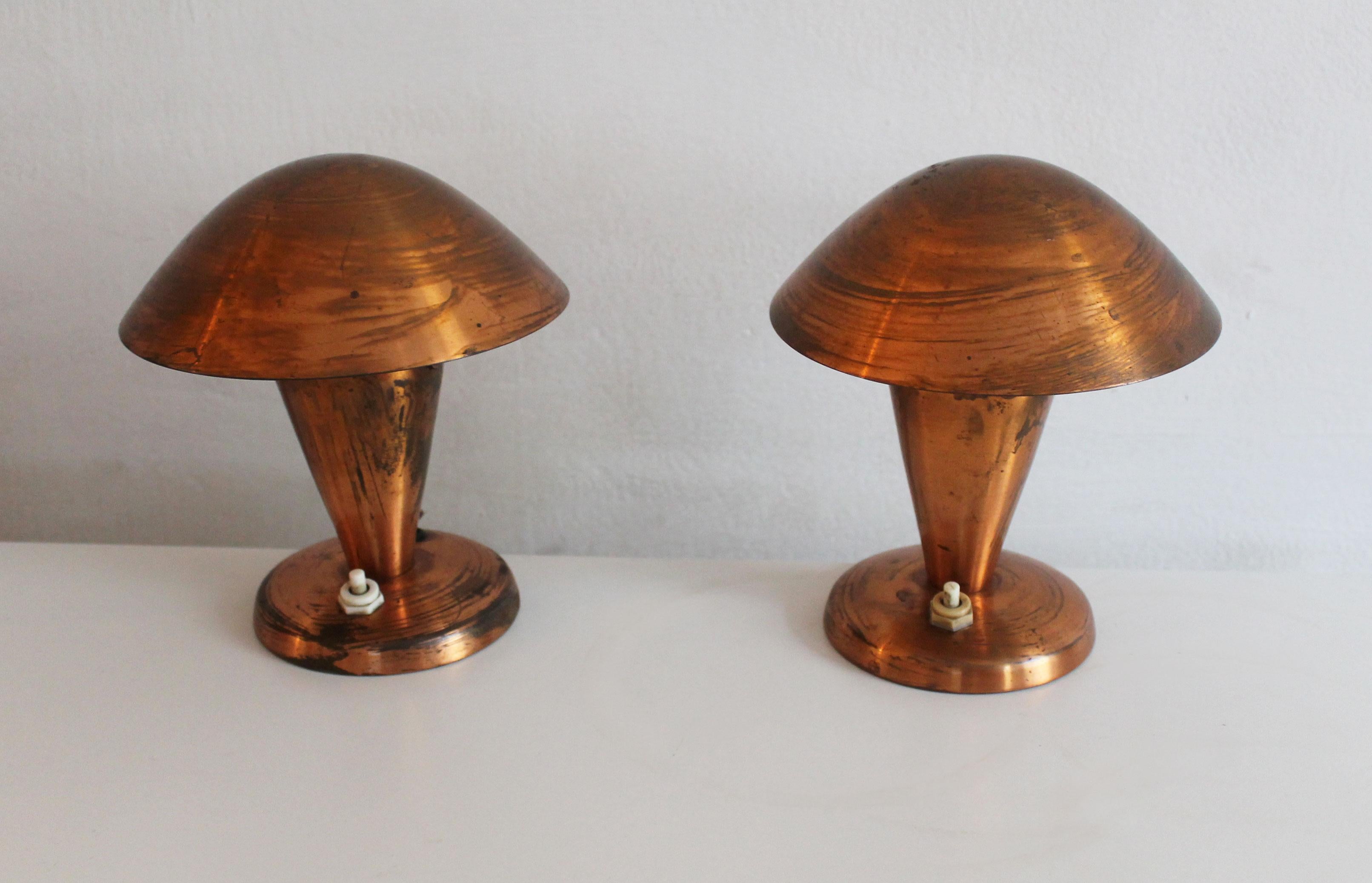 This is an original pair of copper table lamps designed by Vladimir Havel.

Havel was a very interesting person; he studied metalwork and later painting at the Academy of Fine Arts. From the late 1940’s, Vladimir Havel worked as a main lightning