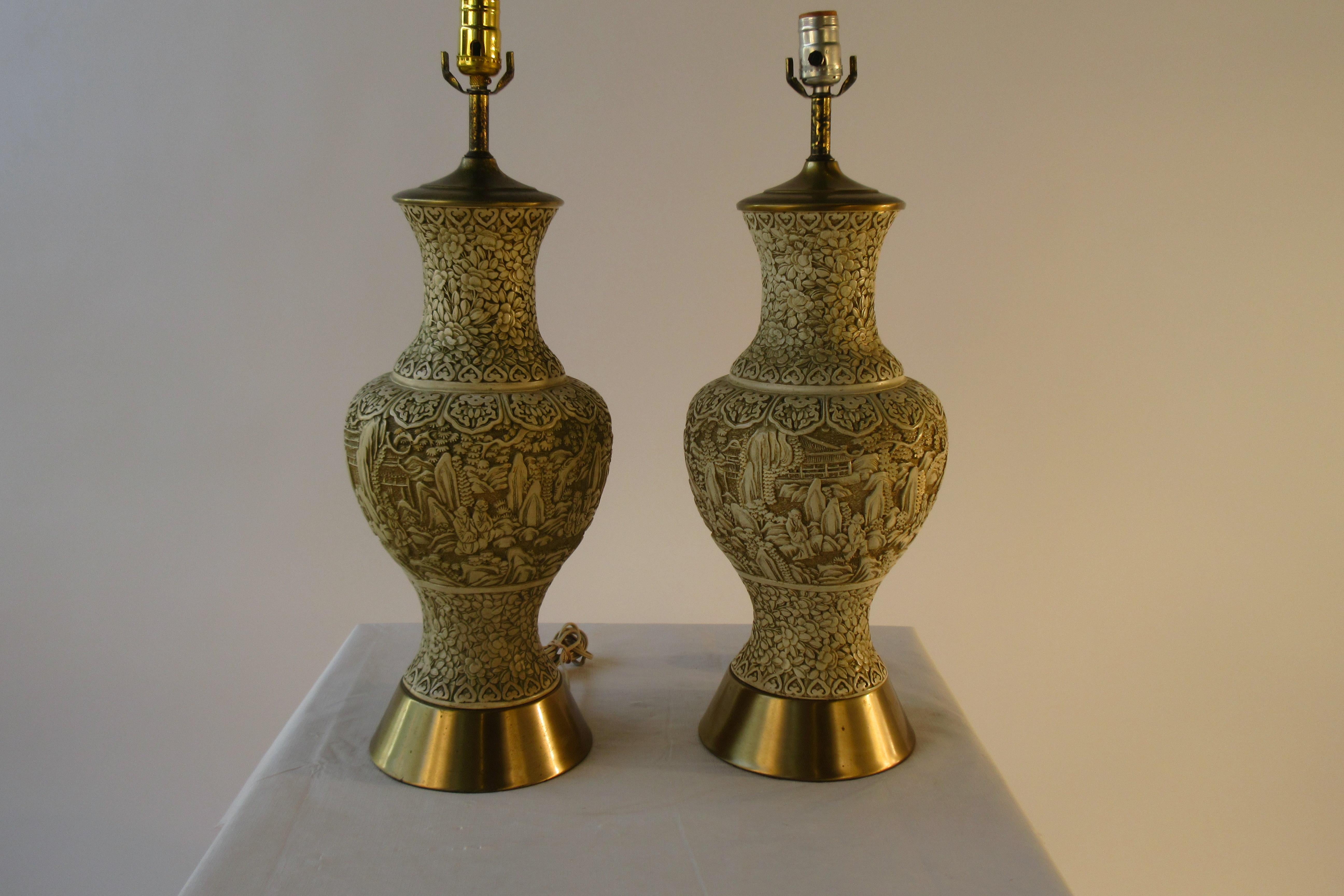 Pair of 1950s plaster Asian style lamps with brass plated bases. Wear to brass on base and canopy.