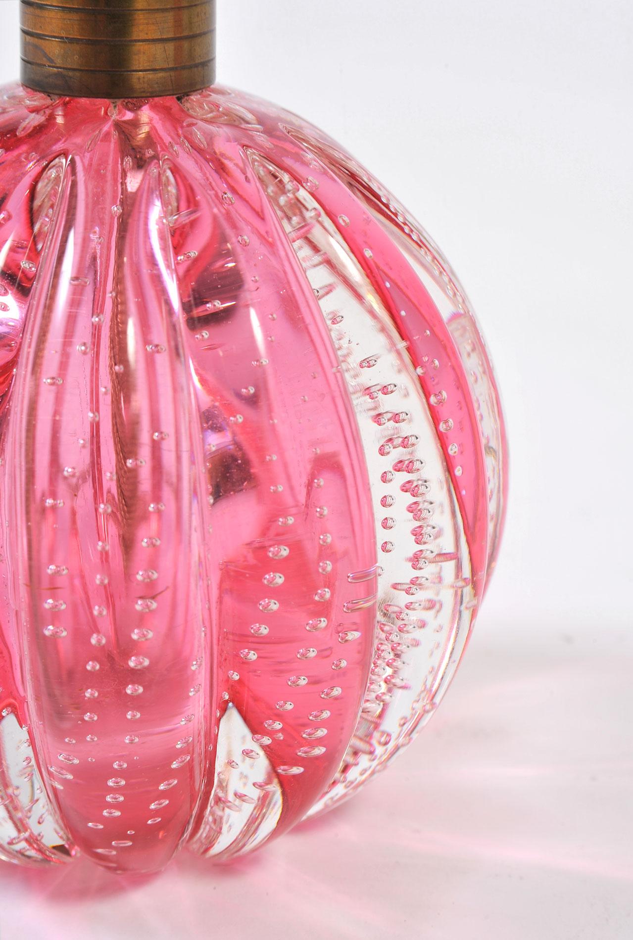 Pink and clear Murano Italian glass ball lamps infused with tiny bubbles. Shaped with ribbed sides to enhance the dimensions.
  