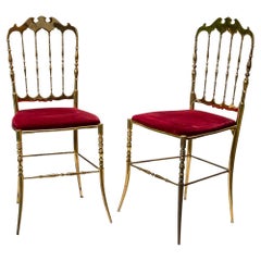 Pair of 1950s red velvet upholstered brass metal chairs by Chiavari