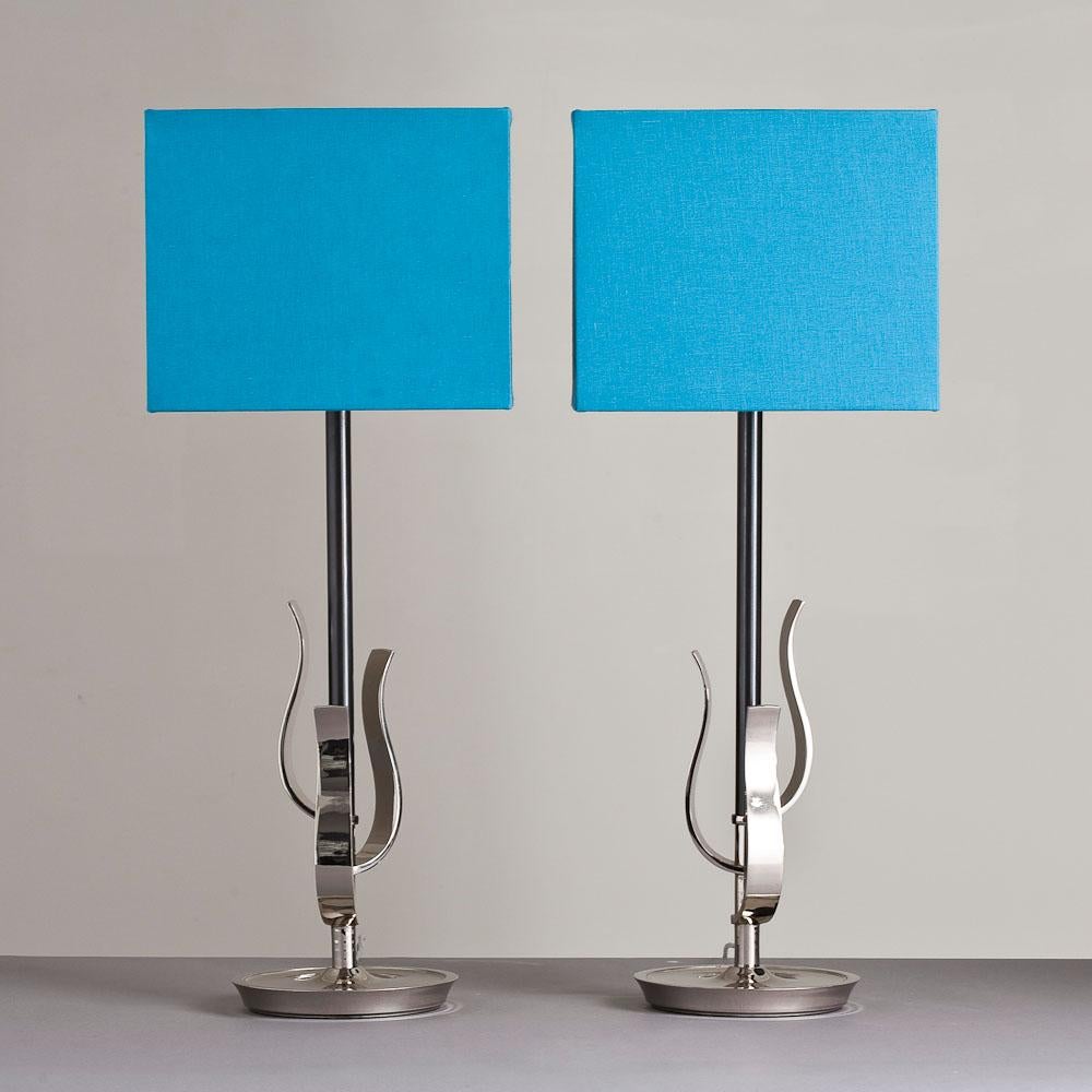 A pair of sturdy lamps with wavy metalwork attached to a nickel plated stem by the Rembrandt Lamp Company 1950s accompanied with Talisman selected fabric shades in electric blue. 