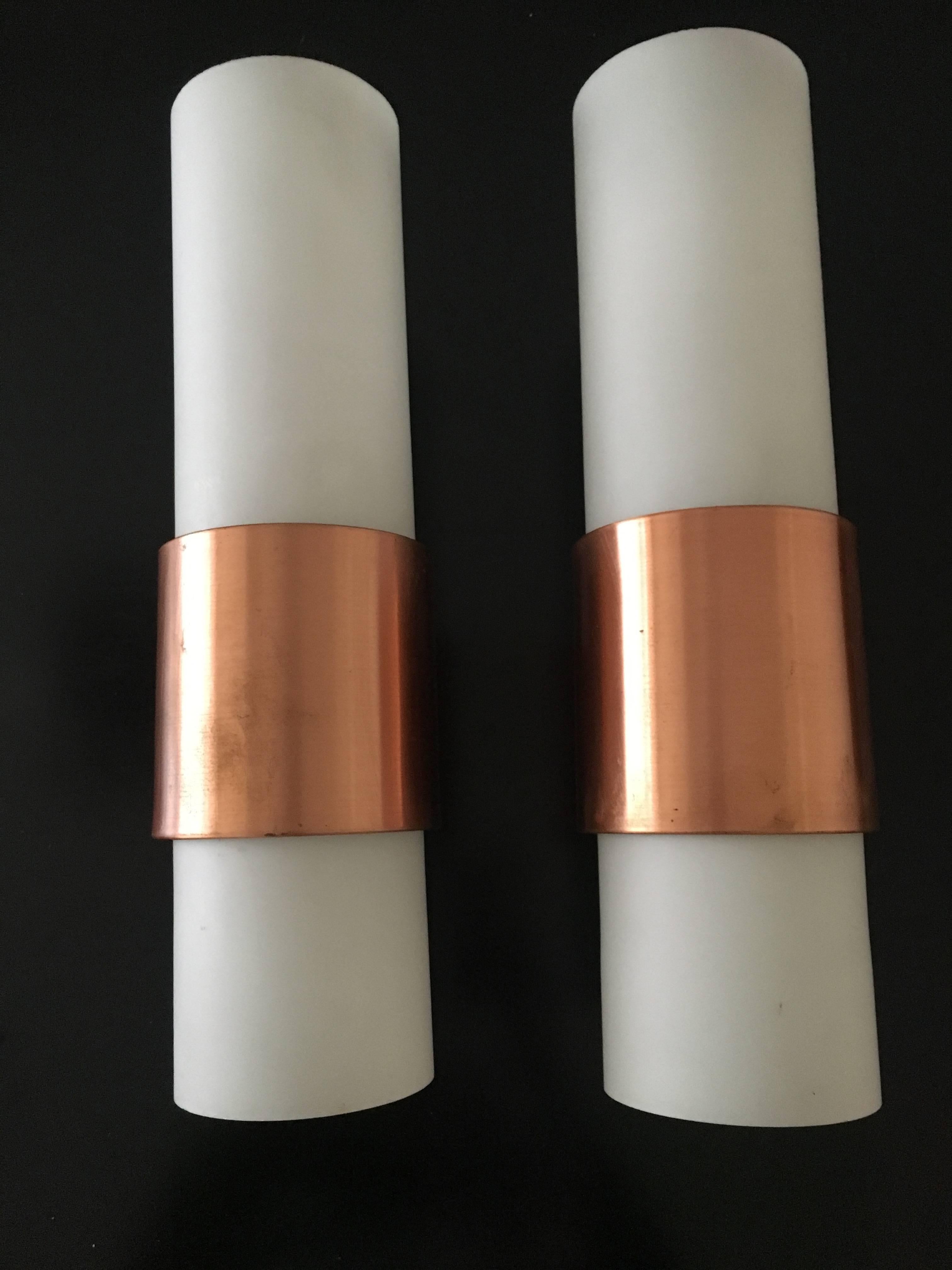 Large lights with white opaline and copper finish metal inlay.