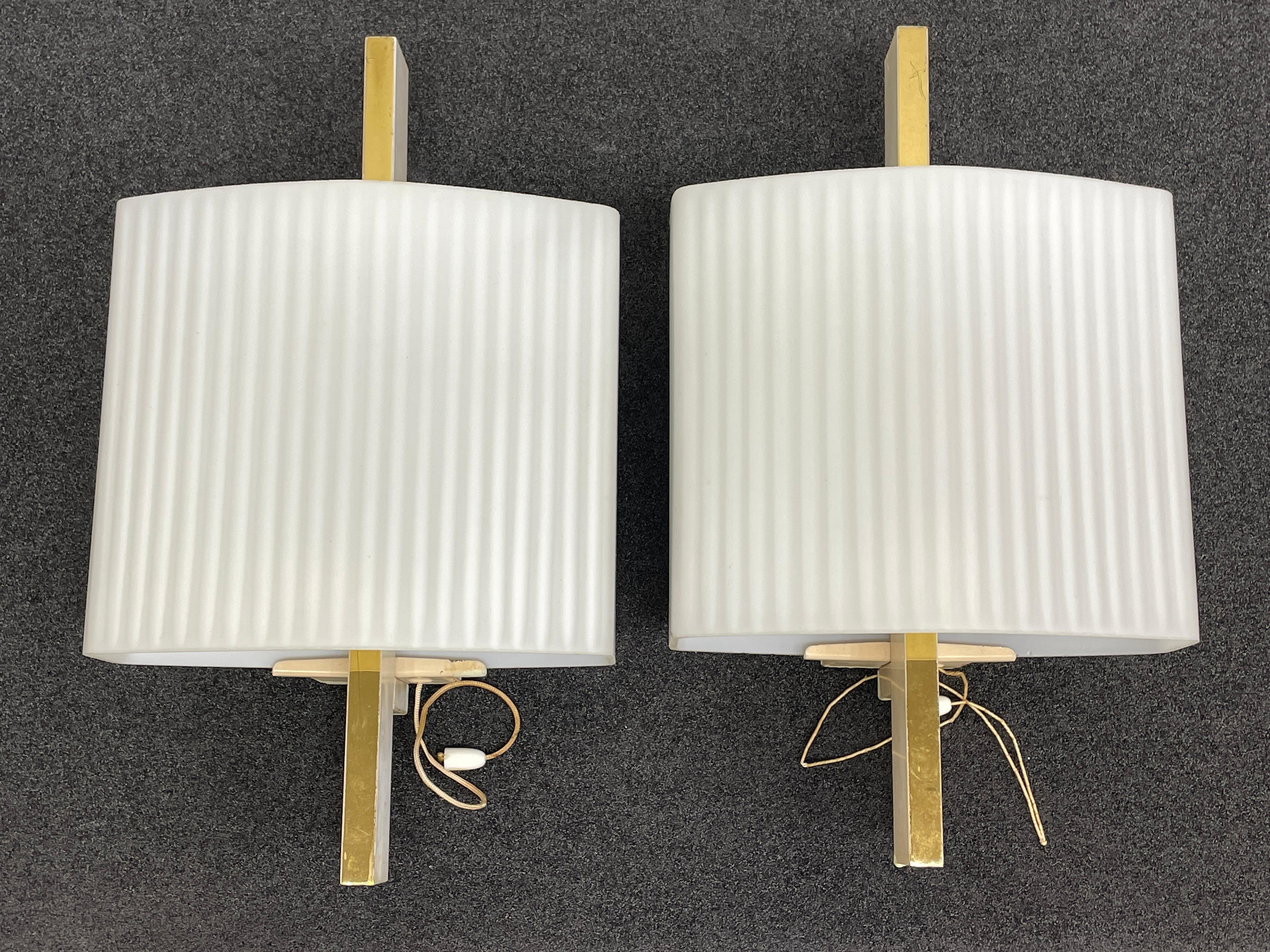 Pair of 1950s Stilnovo style sconces. Original European wiring. Very Mid-Century Modern looking. Each fixture requires one European E14 / 110 Volt candelabra bulb, up to 60 watts. Nice chic Mid-Century Modern design gives a real classy statement.
