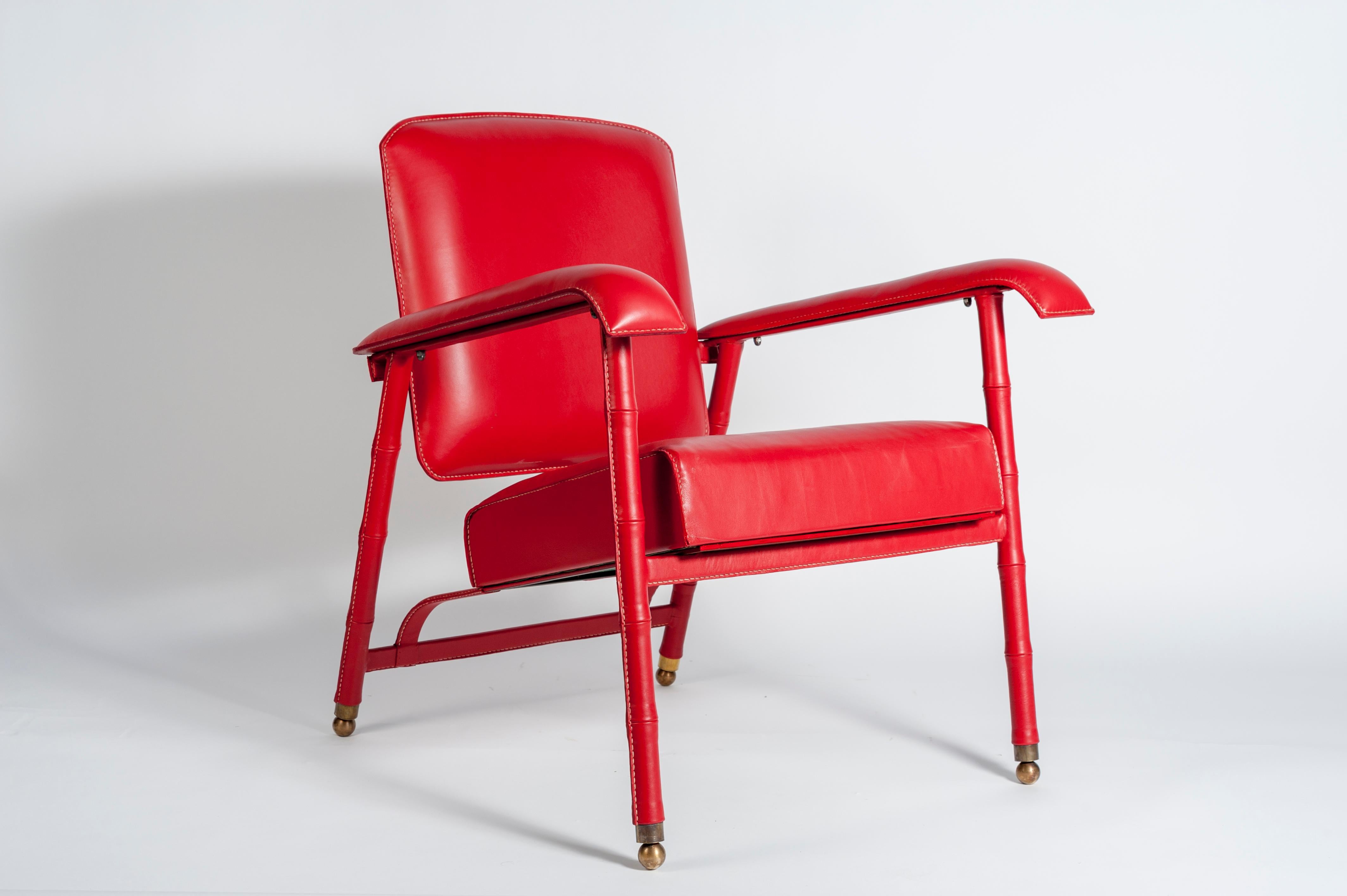 Rare paire de fauteuils en cuir surpiqué de Jacques Adnet
1950's
France.
 