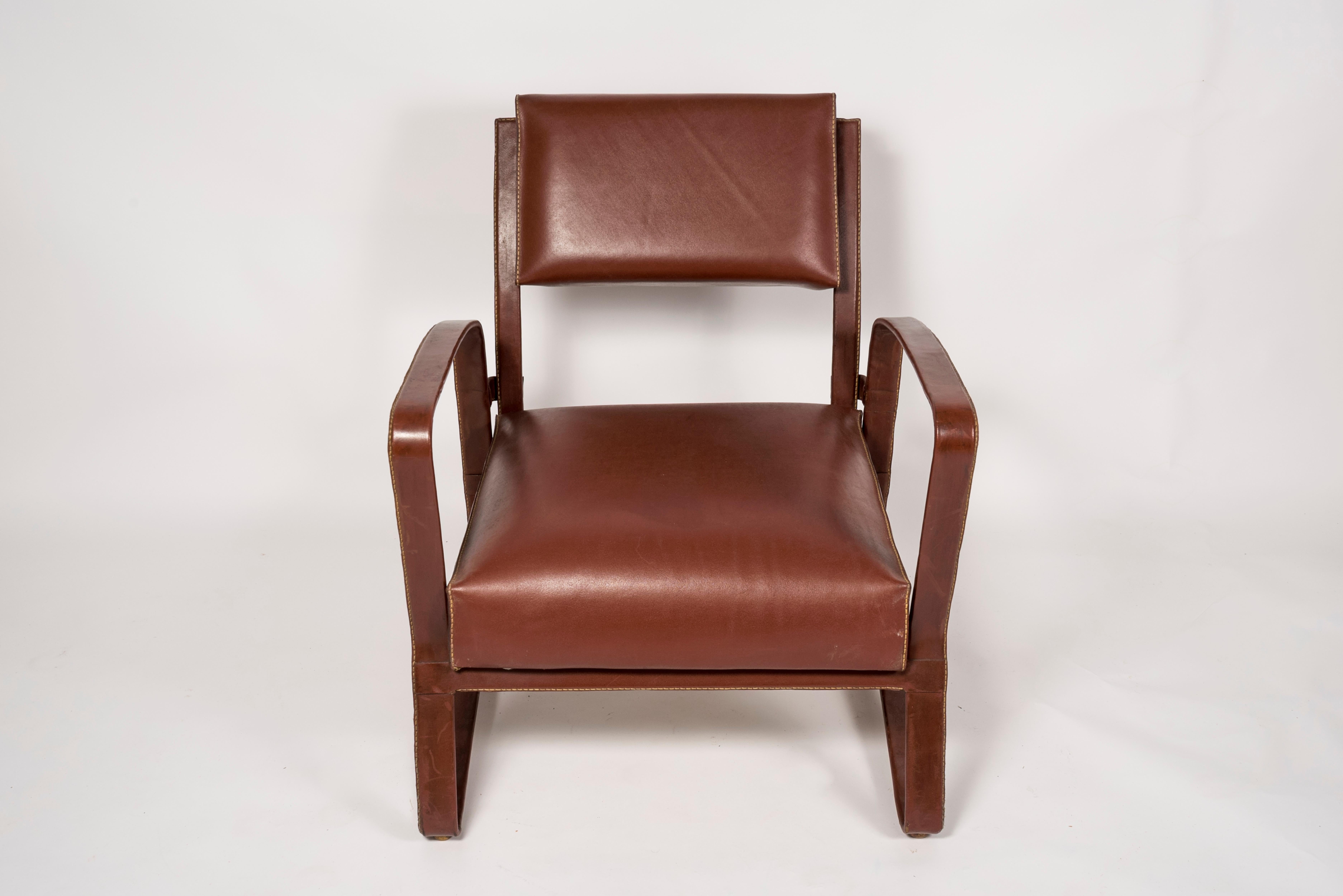 Metal Pair of 1950's Stitched Leather Armchairs by Jacques Adnet For Sale