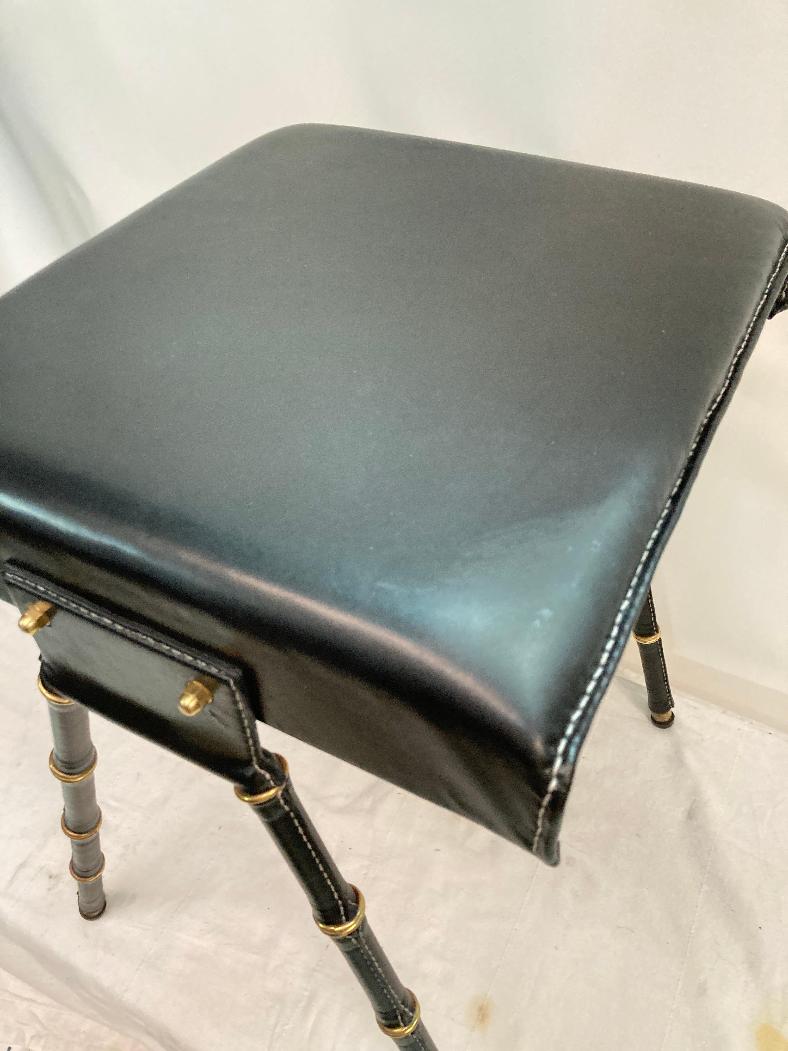 Pair of 1950's Stitched leather ottomans by Jacques Adnet In Good Condition For Sale In Bois-Colombes, FR