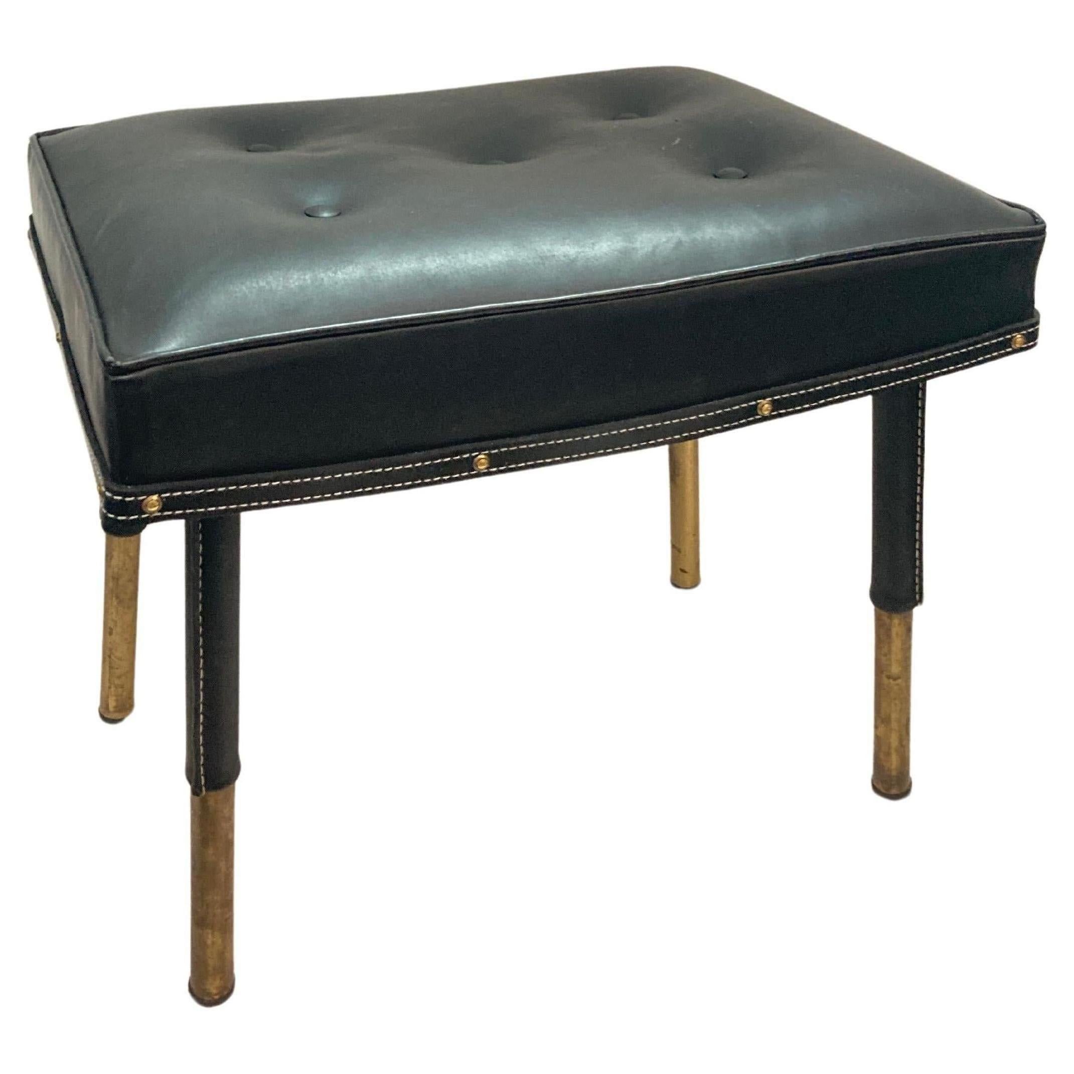 Pair of 1950's Stitched leather ottomans by Jacques Adnet For Sale