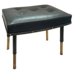 Pair of 1950's Stitched leather ottomans by Jacques Adnet