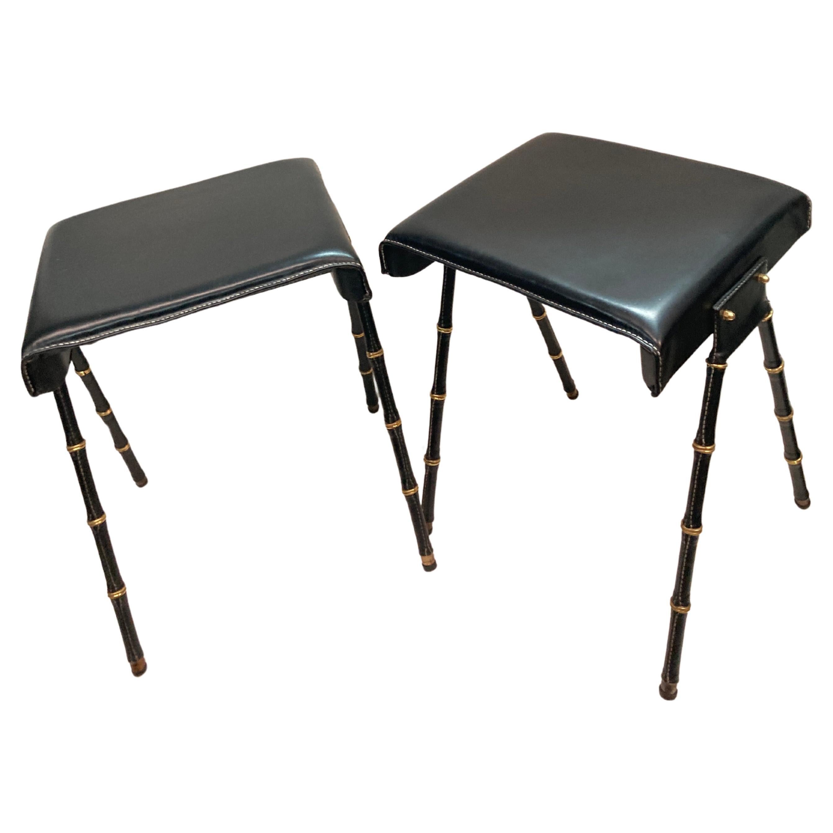 Pair of 1950's Stitched leather ottomans by Jacques Adnet For Sale