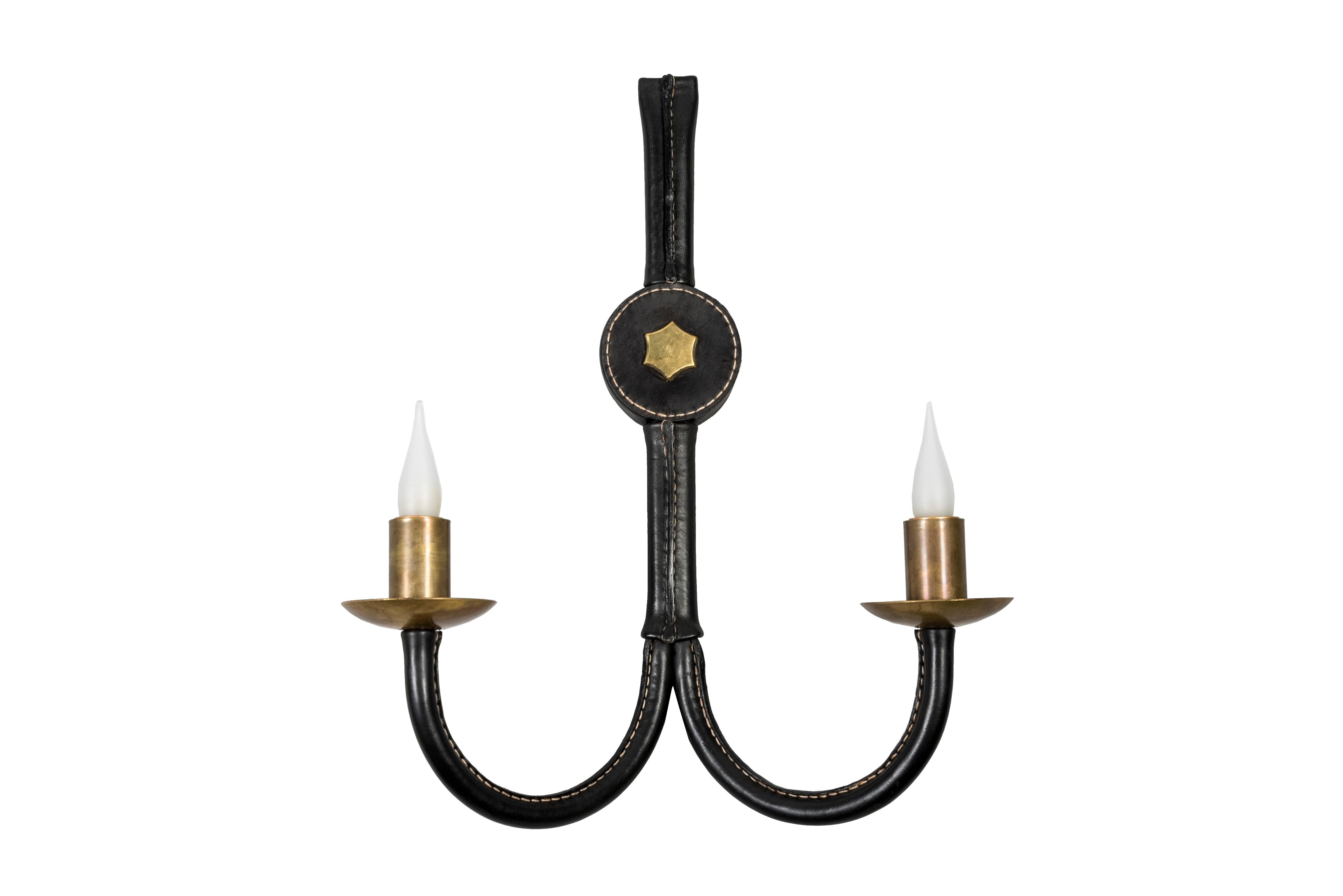 Pair of Stitched leather sconces designed by Jacques Adnet
France
Very good condition.
 