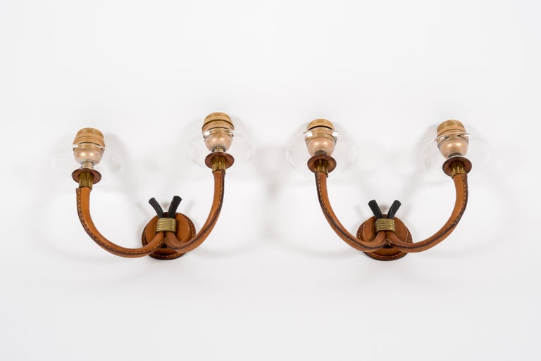 Pair of 1950's Original stitched leather sconces by Jacques Adnet
Very nice caramel leather with soft patina
France.