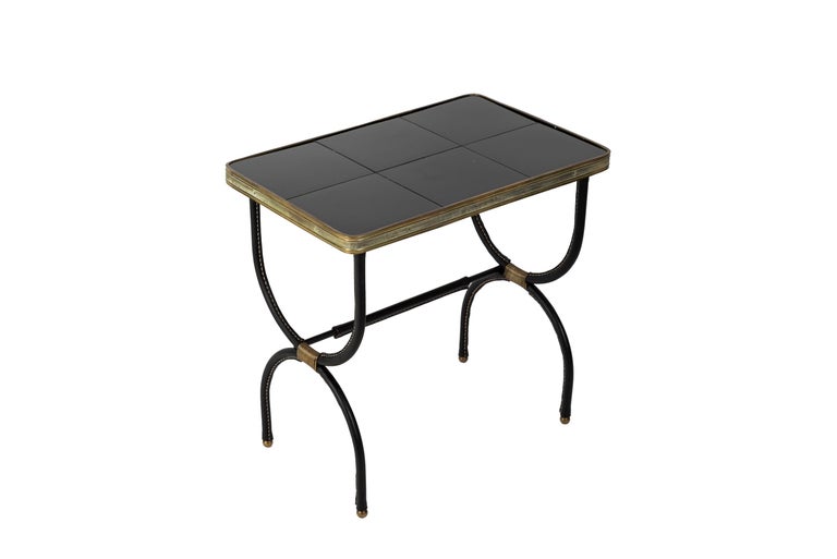 1950's Stitched leather side tables with black ceramic top.
  