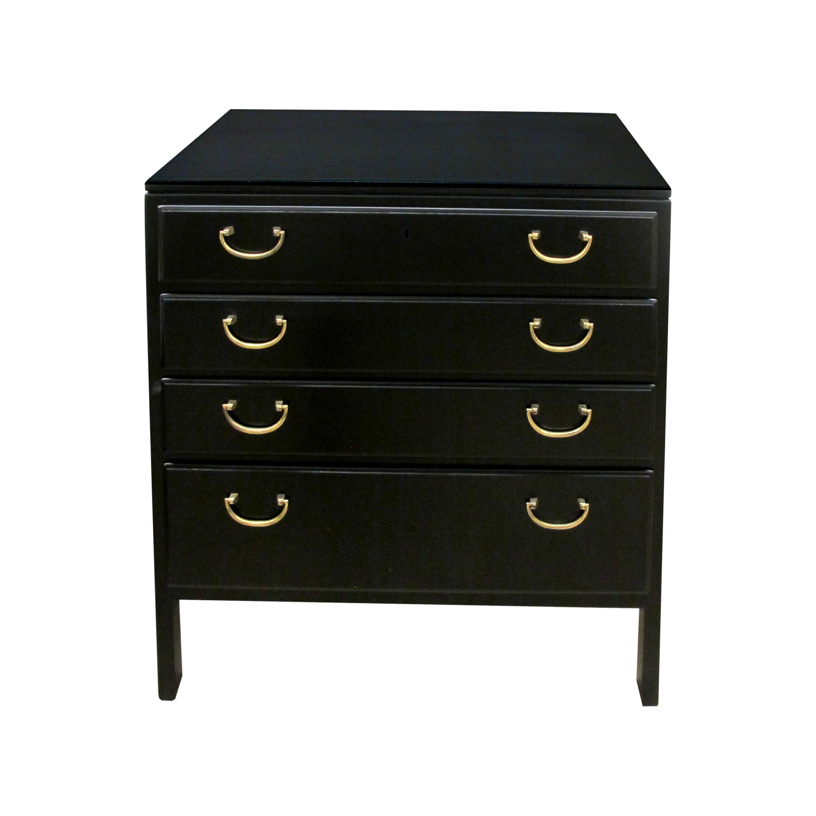 A pair of mid century ebonised chests of drawers designed by David Rosen for Bodafors Furniture. Each chest boasts 3 drawers of equal size and a larger drawer at the bottom which are all presented with their original brass handles. Their simple and