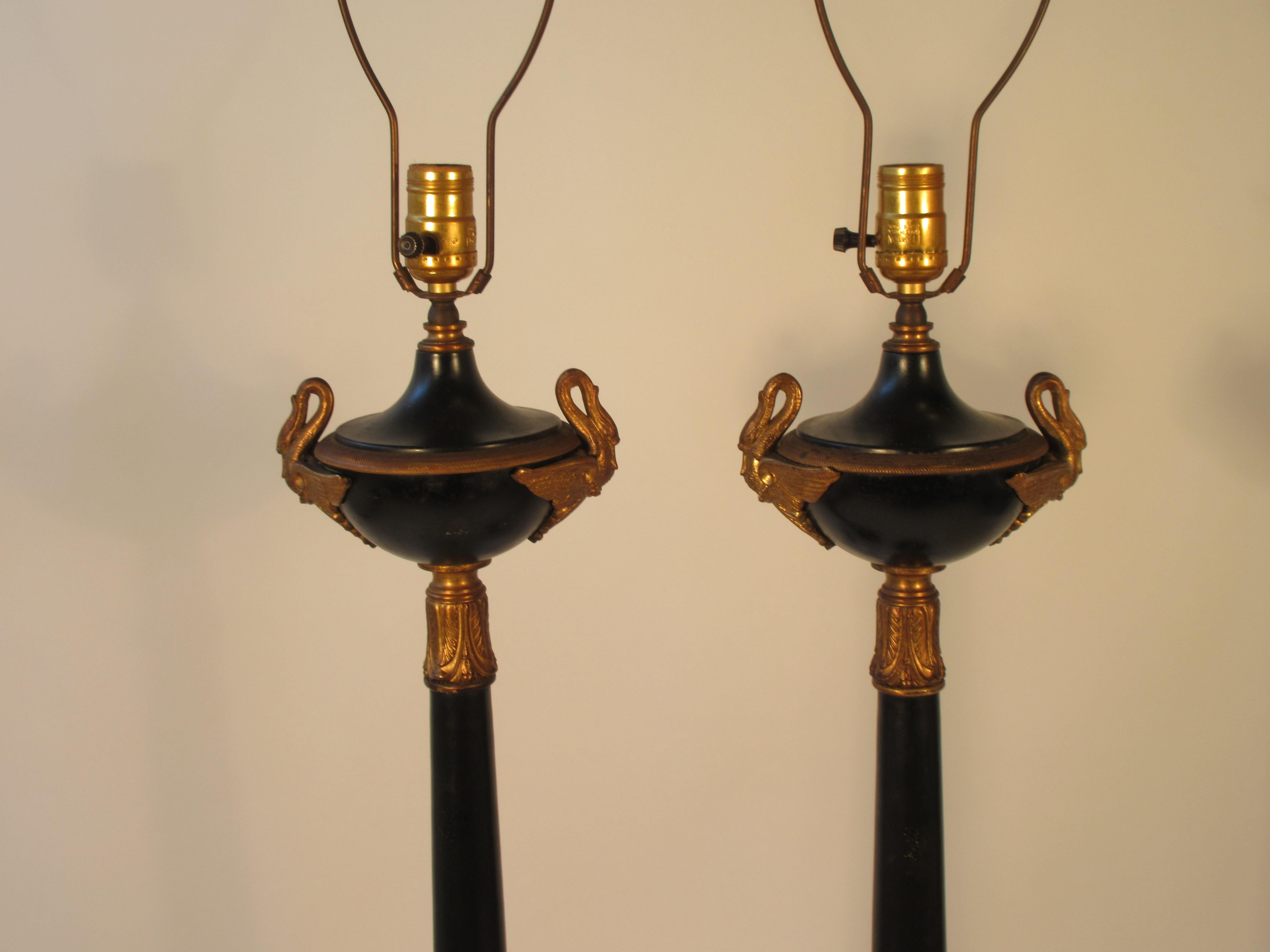 Pair of 1950s tole lamps with brass accents.