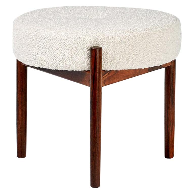 Pair of round ottomans produced in the 1950s in Denmark by Spottrup Mobler. Features 3-leg rosewood frame with round seat pad covered in new Italian bouclé wool fabric. 

  