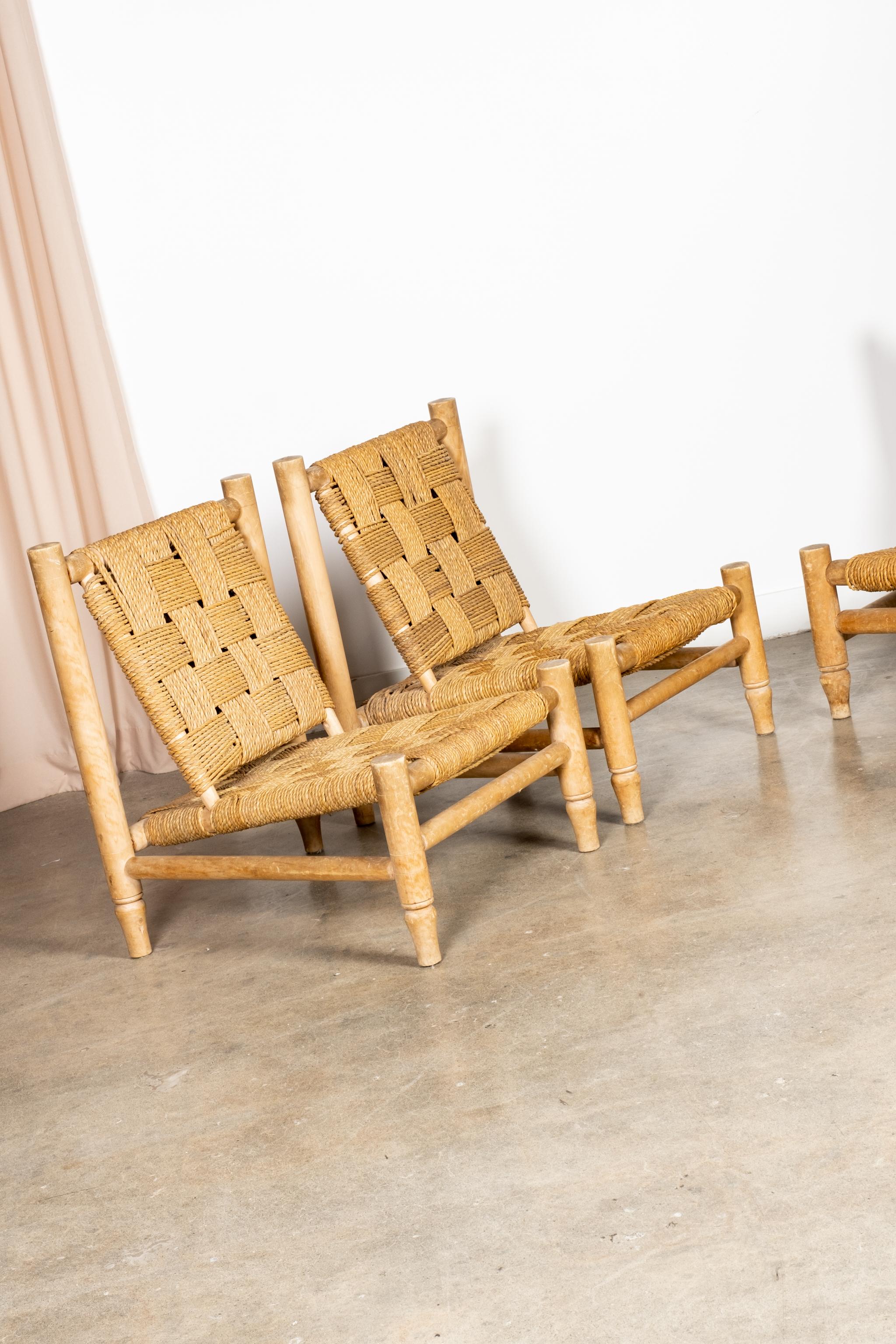 Pair of 1950s lounge chairs designed by French Modernist duo Adrian Audoux and Frida Minet. The primitive hand-turned beech frame clad in Original woven Abaca rope, references coastal living, while celebrating its humble materials - a hallmark of