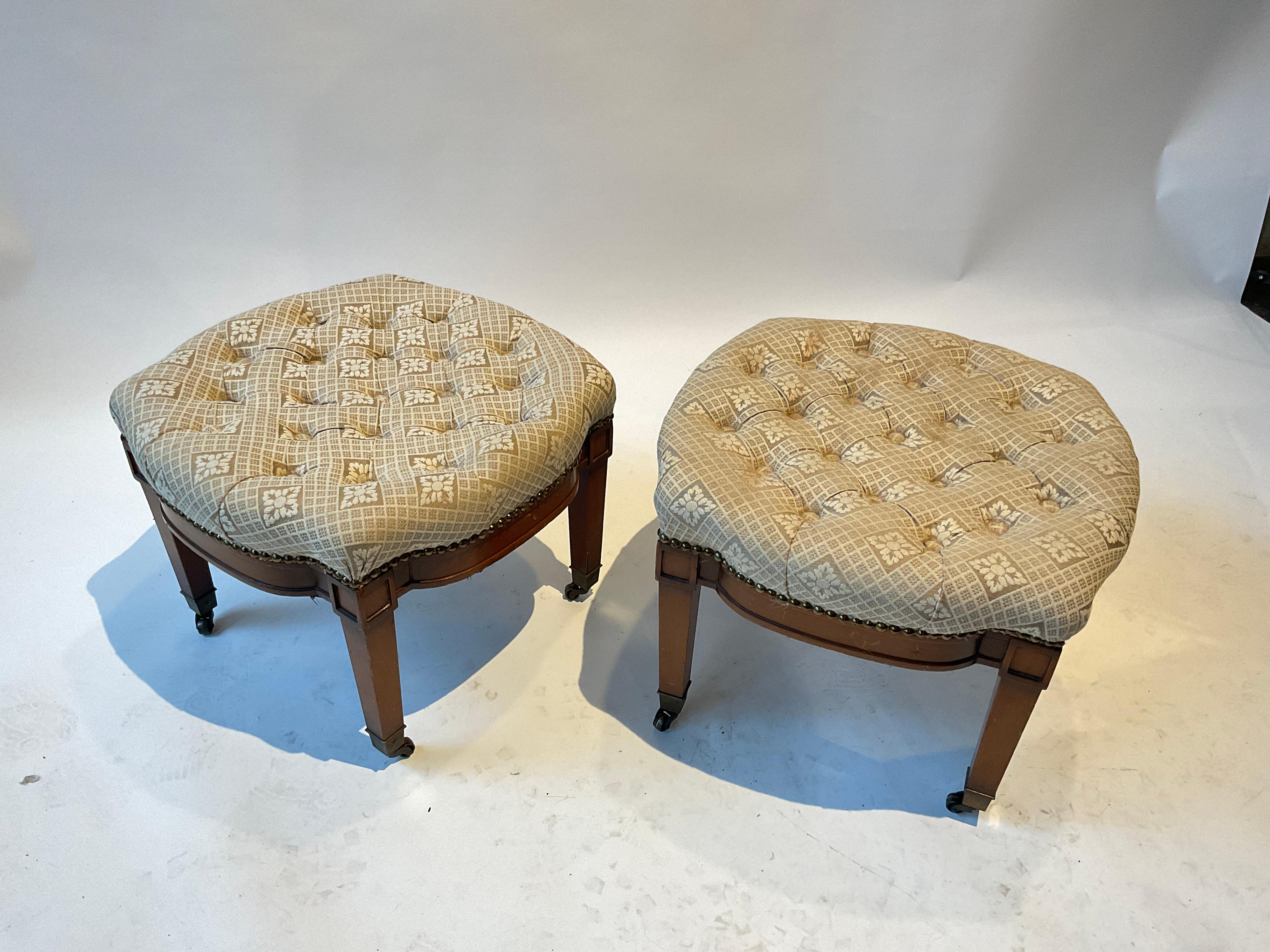 Pair of 1950s wood ottomans on casters. Great shape!.
 