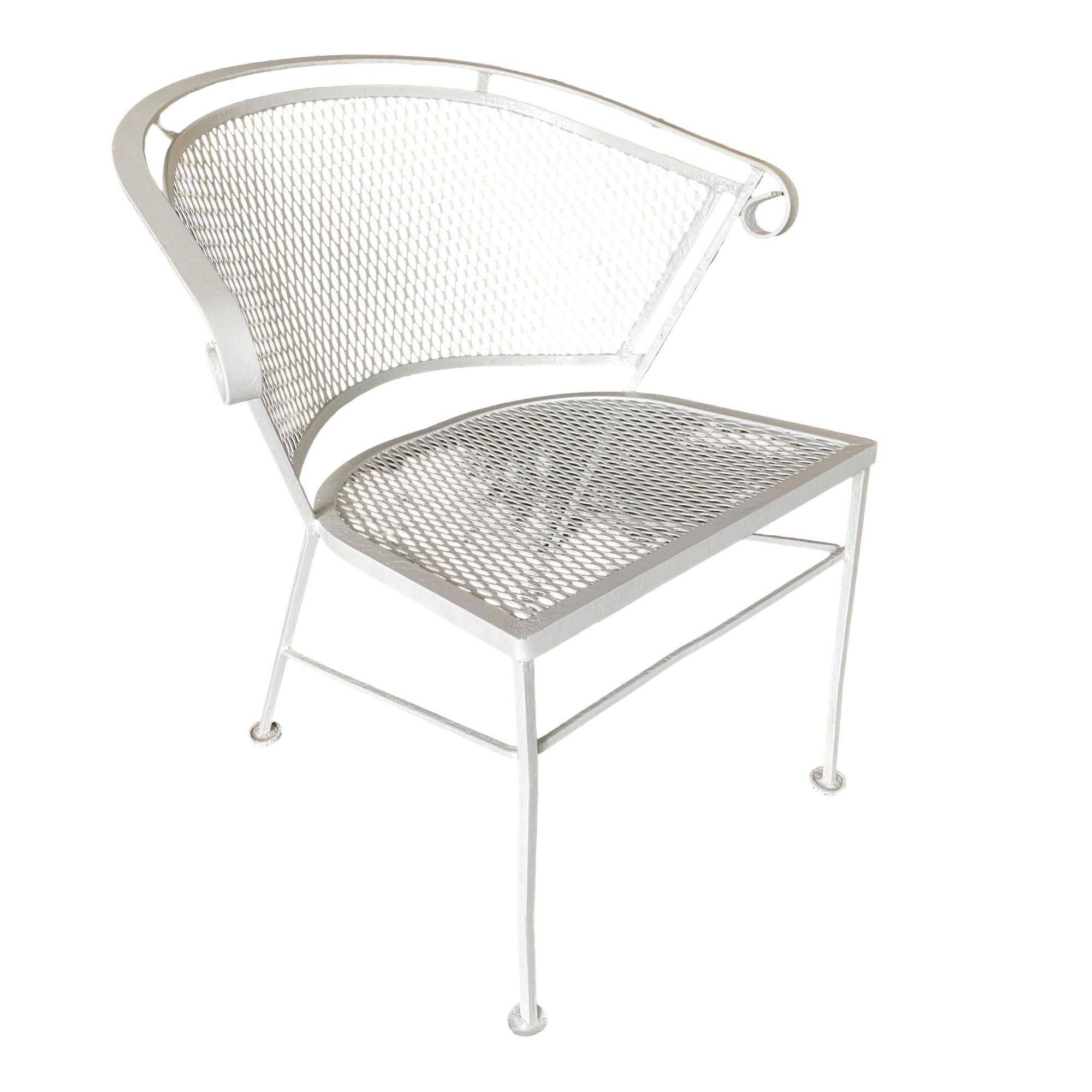 A Pair of Woodard Pinecrest rod iron outdoor/patio chairs with distinct curved modernist backrests. This chair is constructed with solid core iron rods and is finished in your choice of a pure white or black finish with padded seats.

Seat Height: