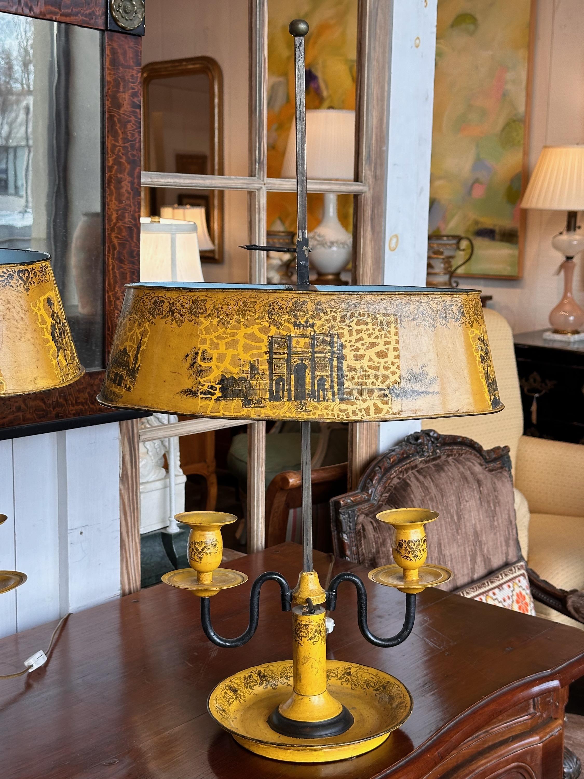 Tole lamps decorated in a neoclassic design. Made in the 1950s.