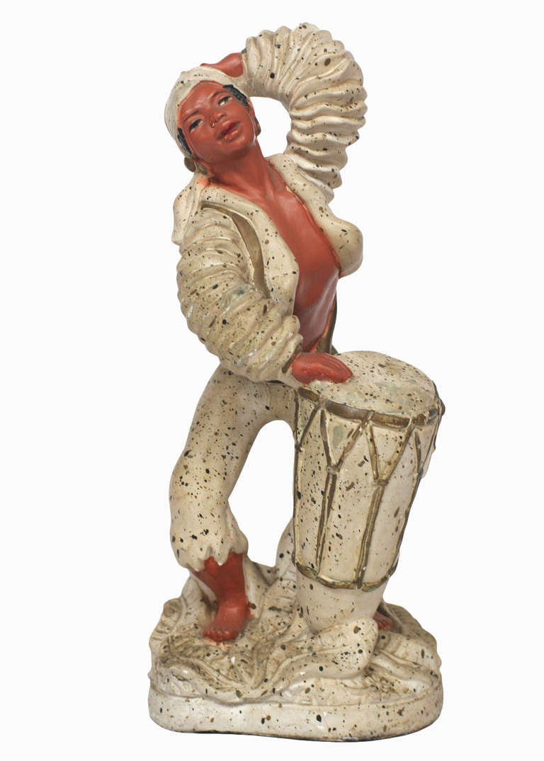 Cuban drummer boy and dancing girl chalk ware statue pair, circa 1955, stamped 