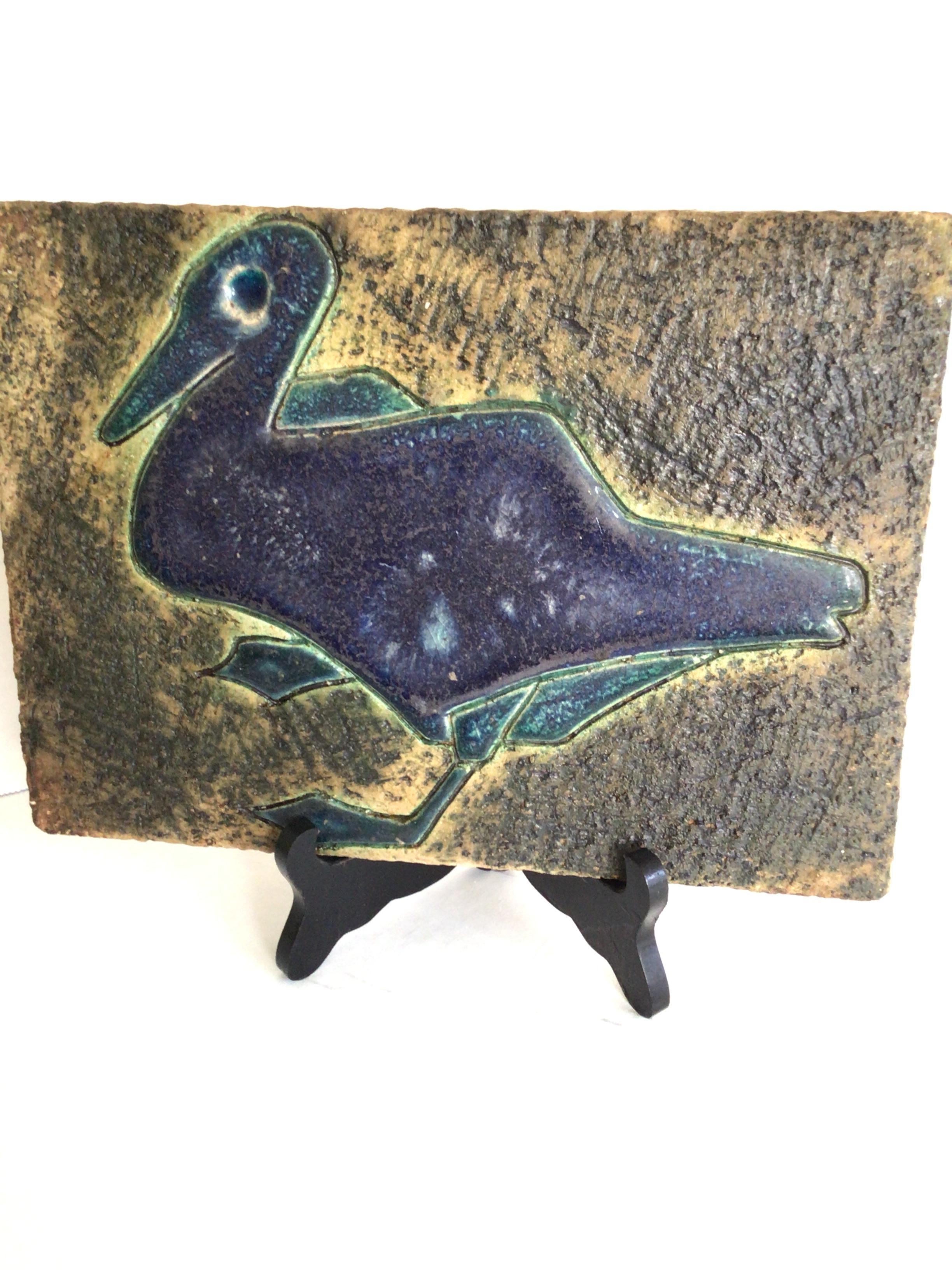 1960 Glazed Ceramic Plaques with Bird Motif (sold as a set)
This pair of generously sized and textural plaques display a Bird, Duck, or type of water foul; and would be a perfect addition to any country estate.
One in a Deep blue and green the other
