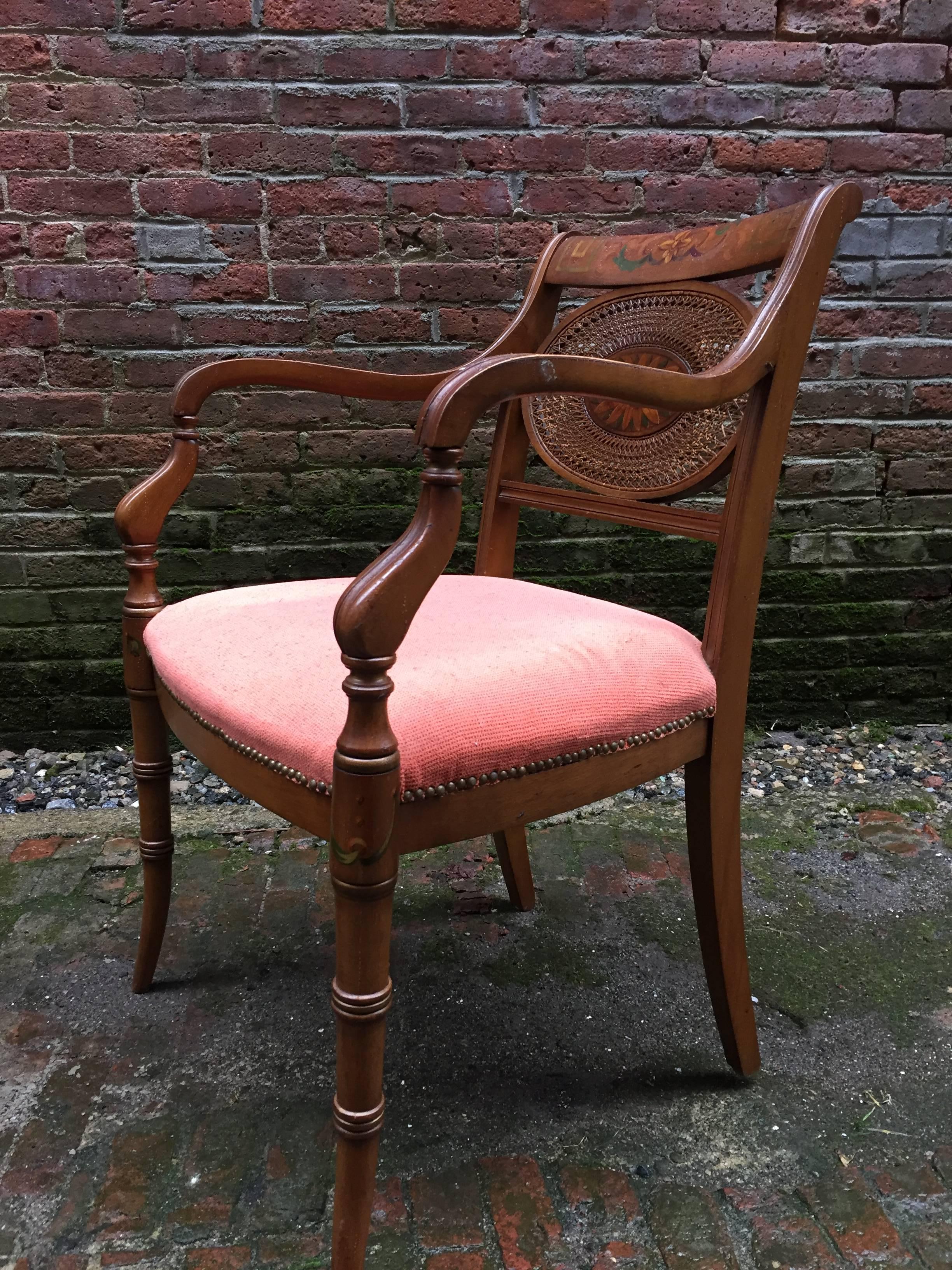 Fine pair of hand-painted Adam style caned and scroll armchairs after the neoclassical style made famous by James and Robert Adam. Decorated with a sunflower and caned back splat. Solid wood construction, circa 1960. Unsigned.