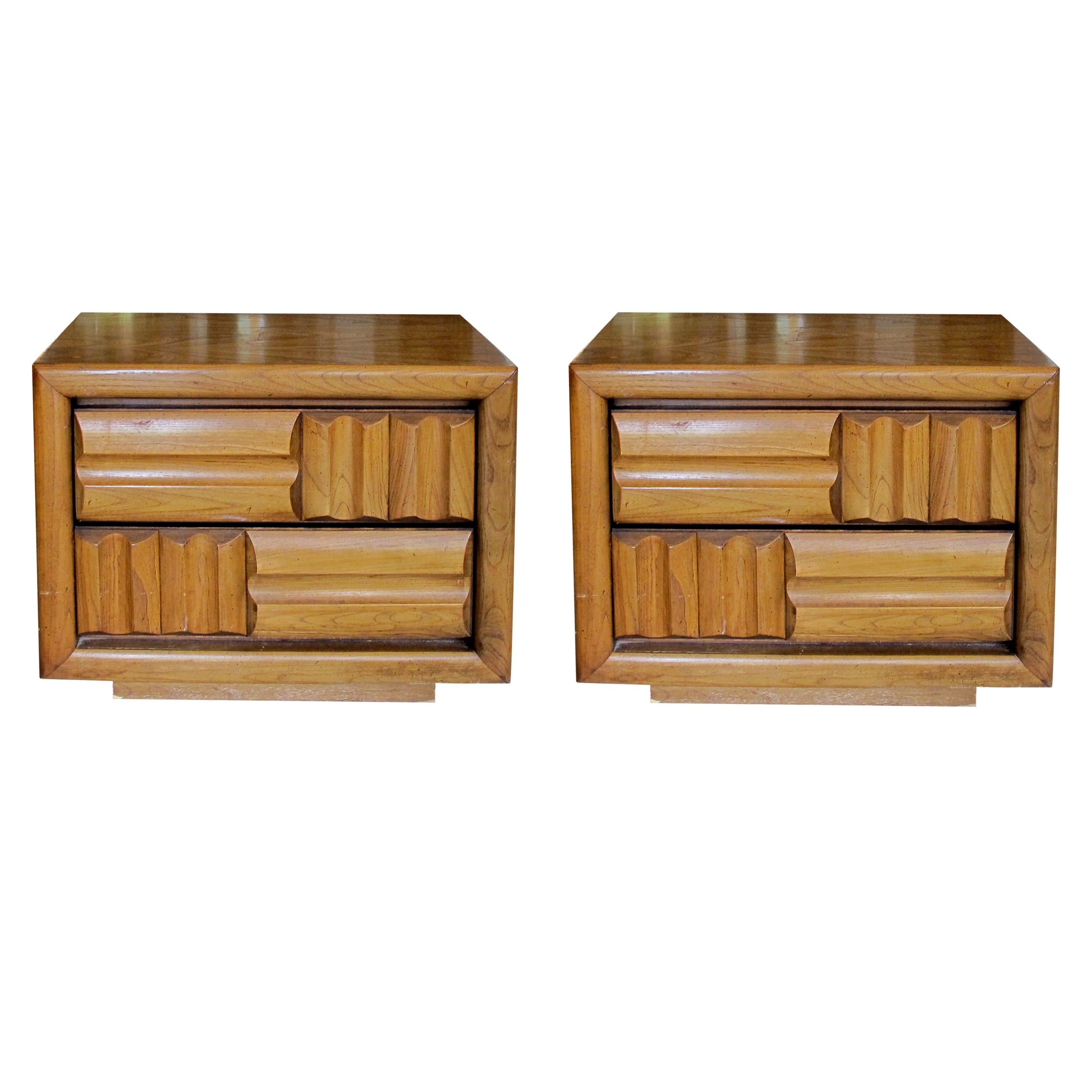 Pair of 1960s American very well-made walnut bedside tables manufactured by Lane which boast a very elegant geometric design with soft curves and angles, each table has two drawers. These tables are versatile and can be used as end, side, or bedside