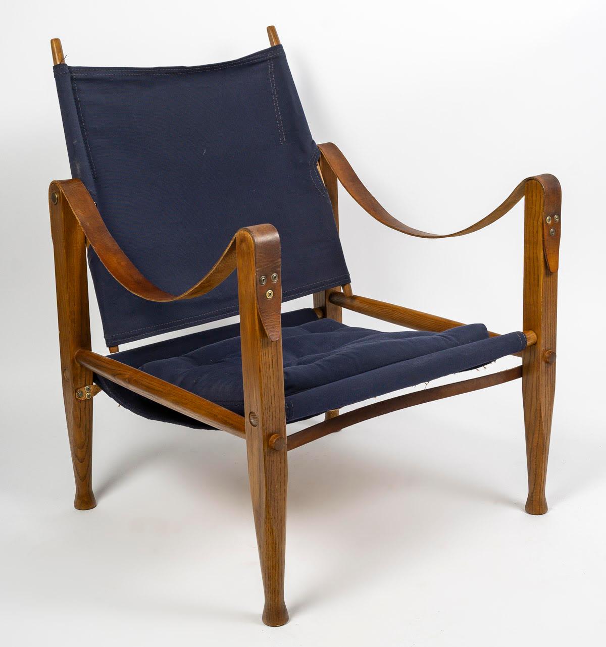 Pair of 1960s armchairs in oak, leather and canvas.

Pair of Safari armchairs in oak, leather and canvas from the 1960s.  
h: 77cm, w: 58cm, d: 61cm