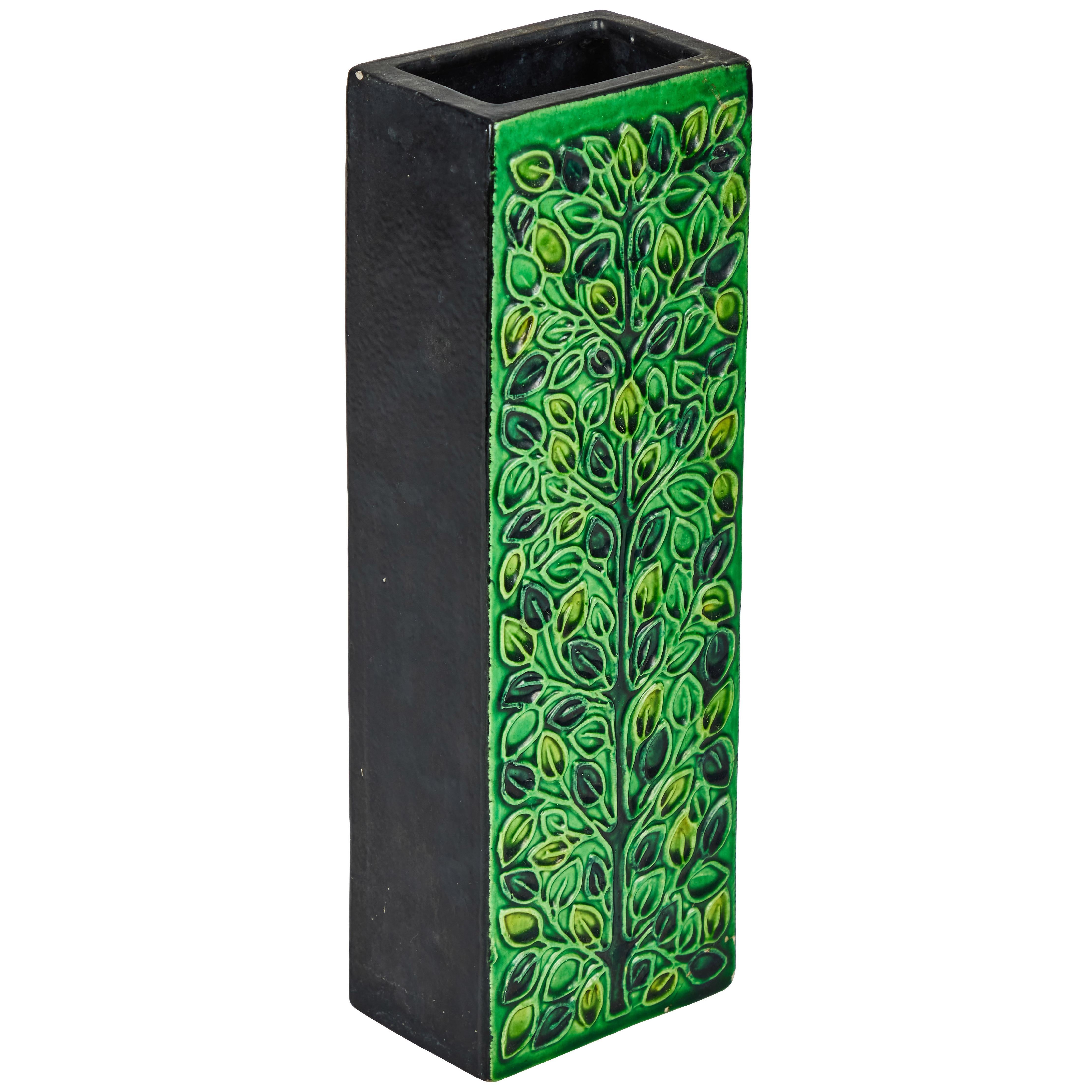 1960s Bitossi rectangular vase by Aldo Londi with Signature. This rare and sculptural pair of is executed in green glazed ceramic with geometric floral embossing. Signature on bottom. A refined yet whimsical design characteristic of the best Italian